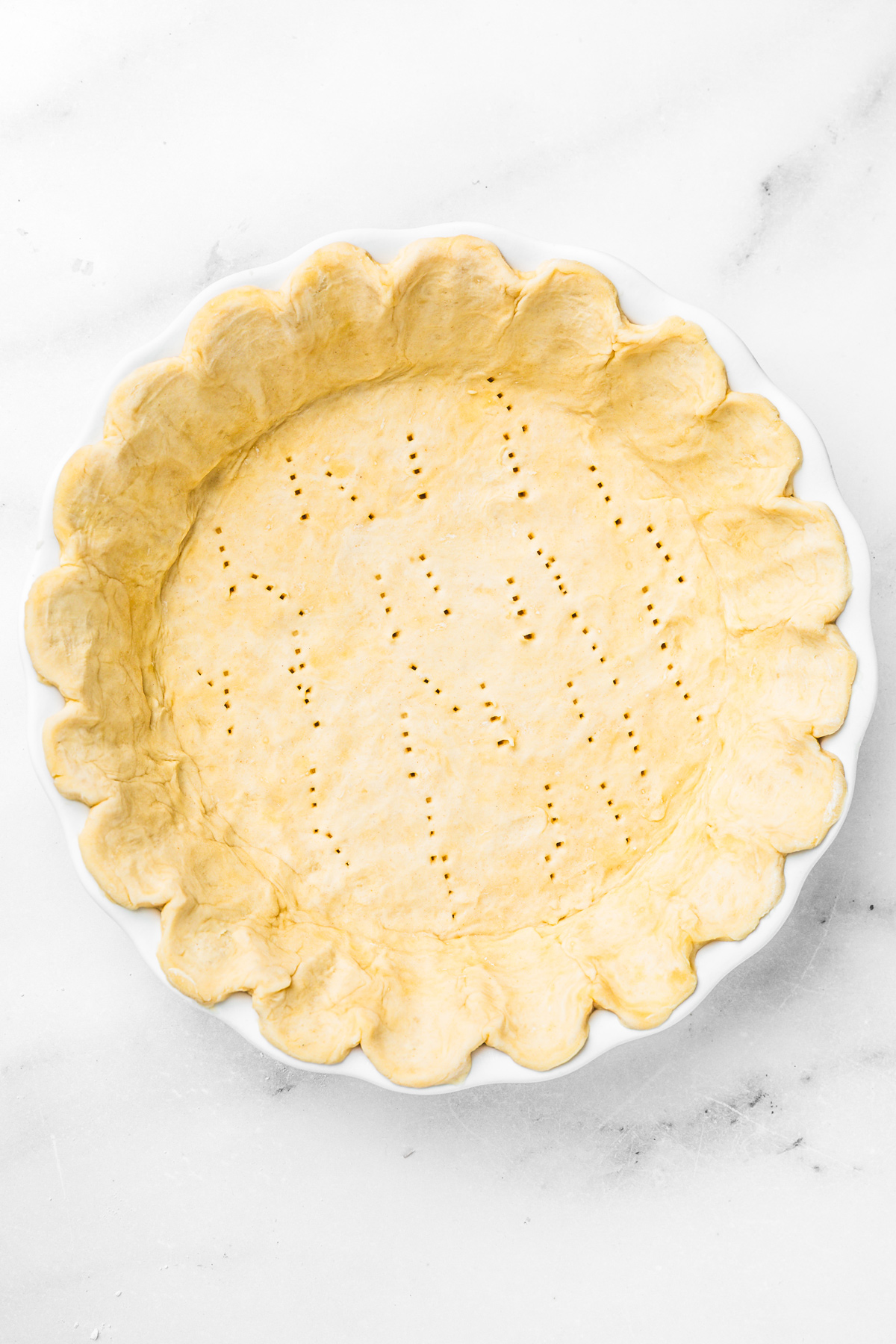 baking dish with pie crust ready for lemon meringue pie