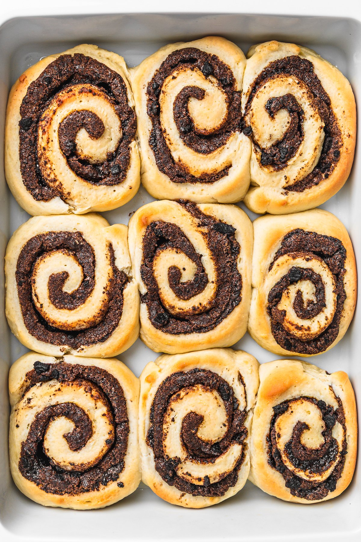 Freshly baked Oreo cinnamon rolls with gooey cookies and cream filling