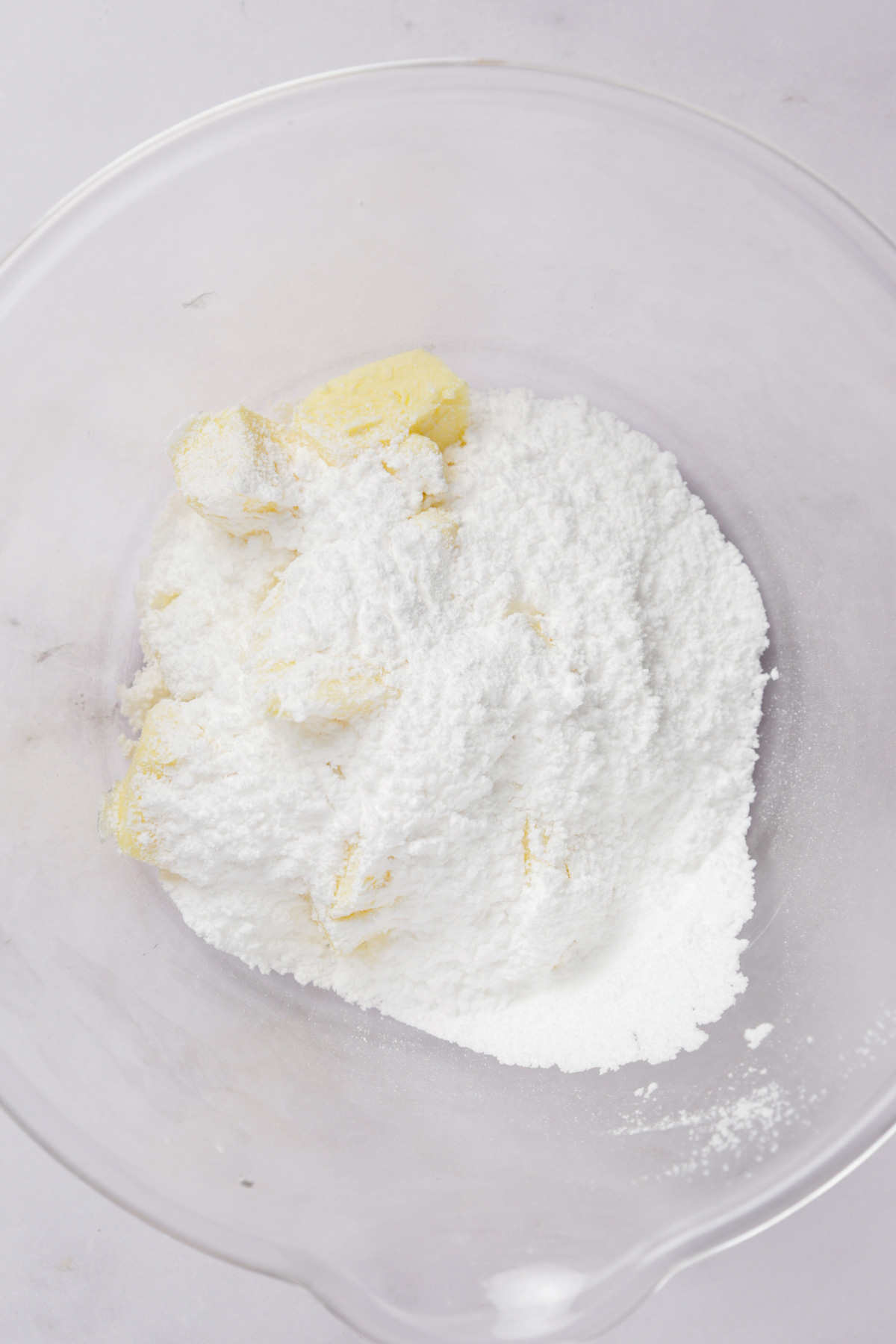 mixing sugar and butter for lemon thumbprint cookie dough