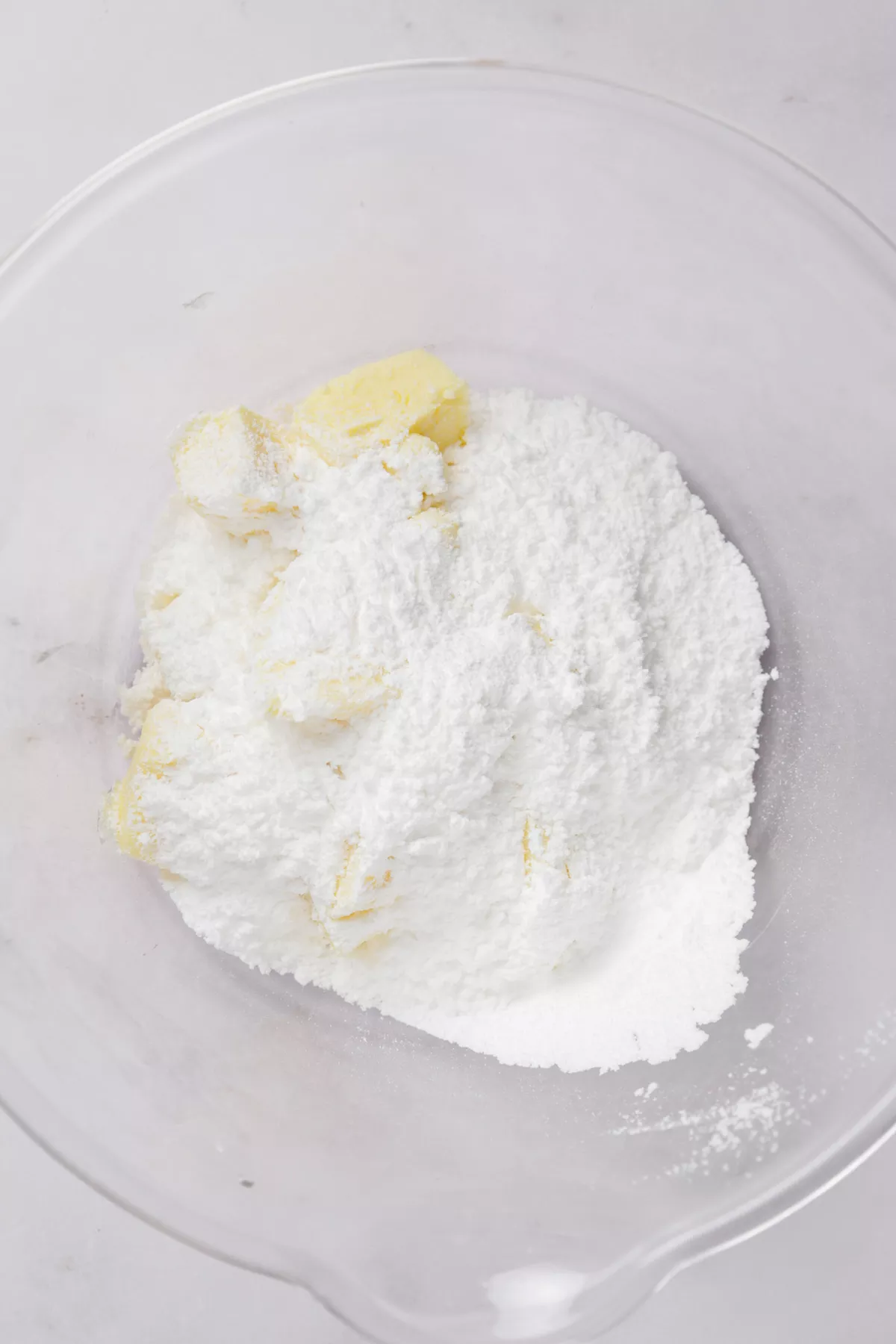 mixing sugar and butter for lemon thumbprint cookie dough