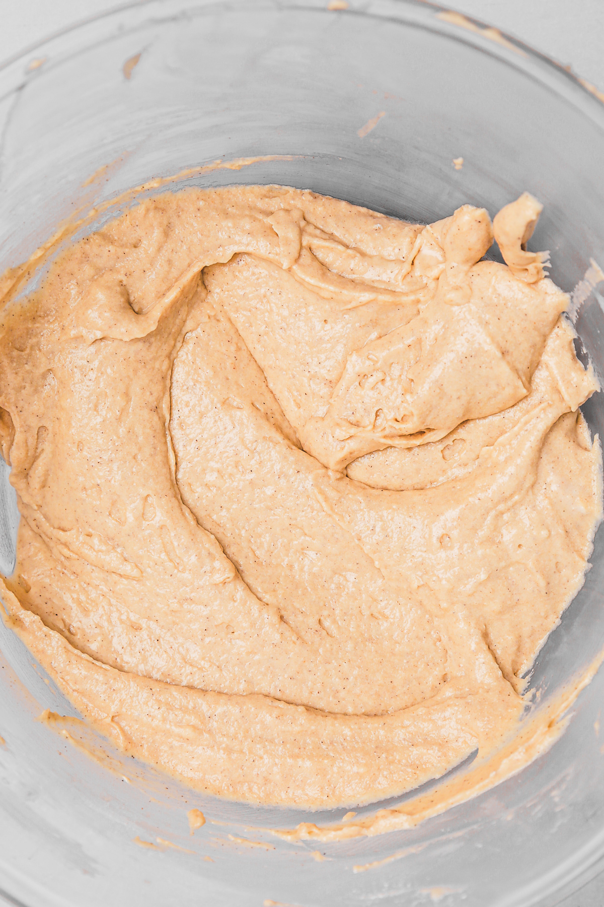 Cinnamon cupcake batter in a mixing bowl