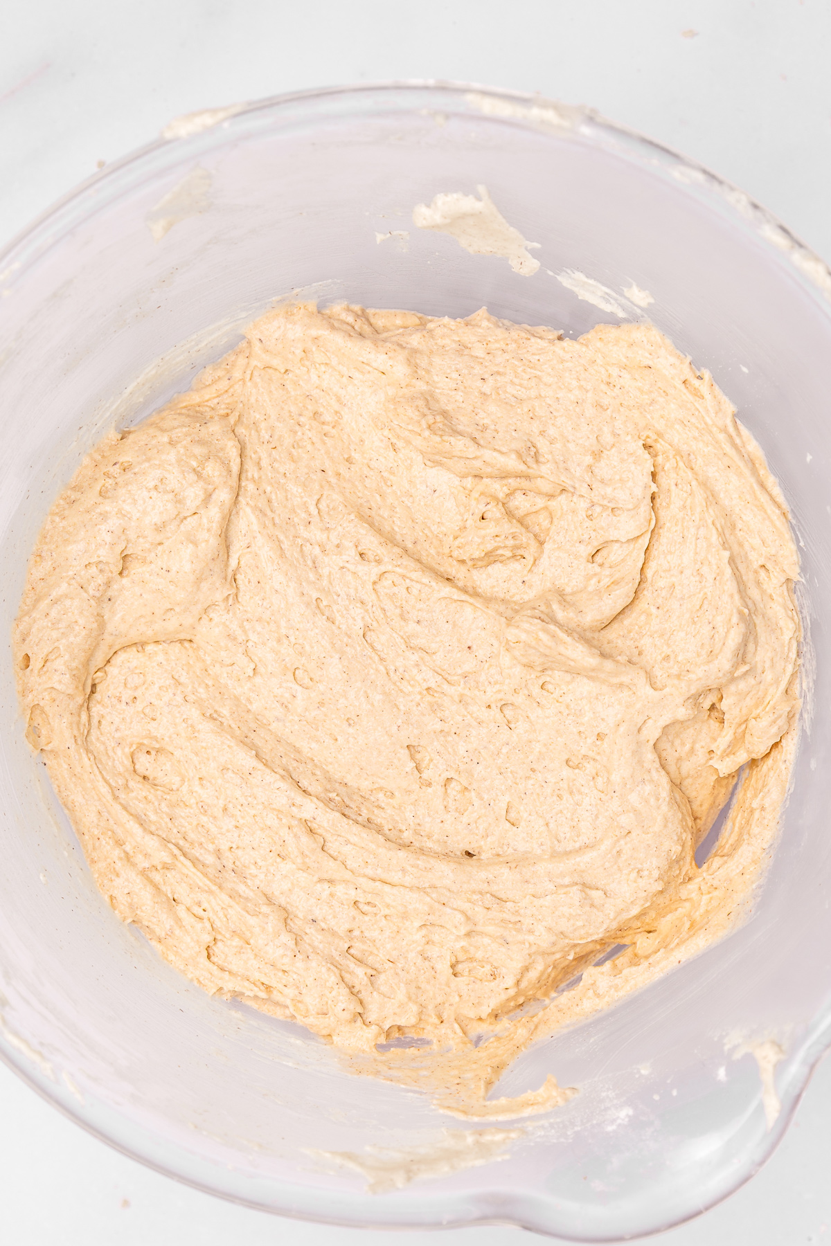 Mixing bowl with cinnamon cake batter