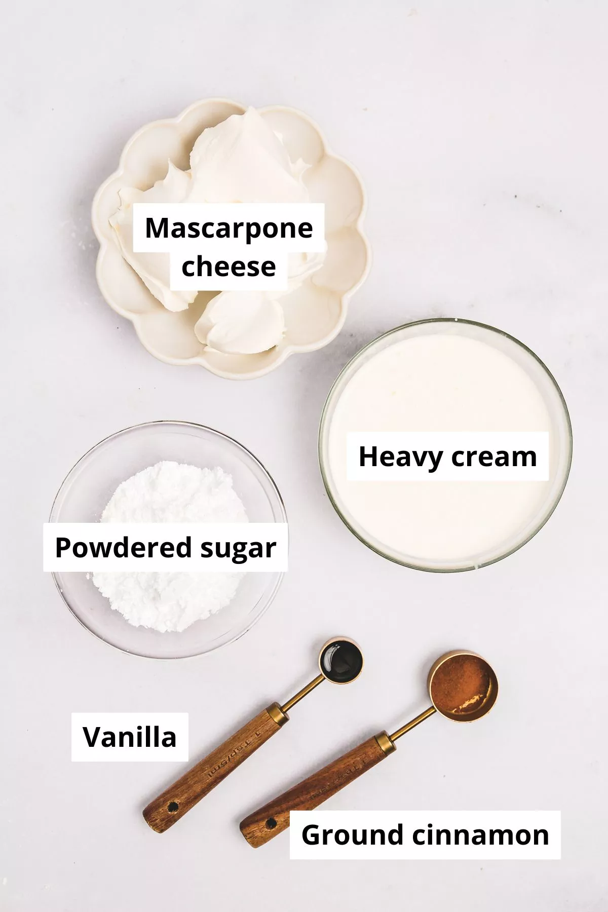 Ingredients in bowls for cinnamon whipped cream