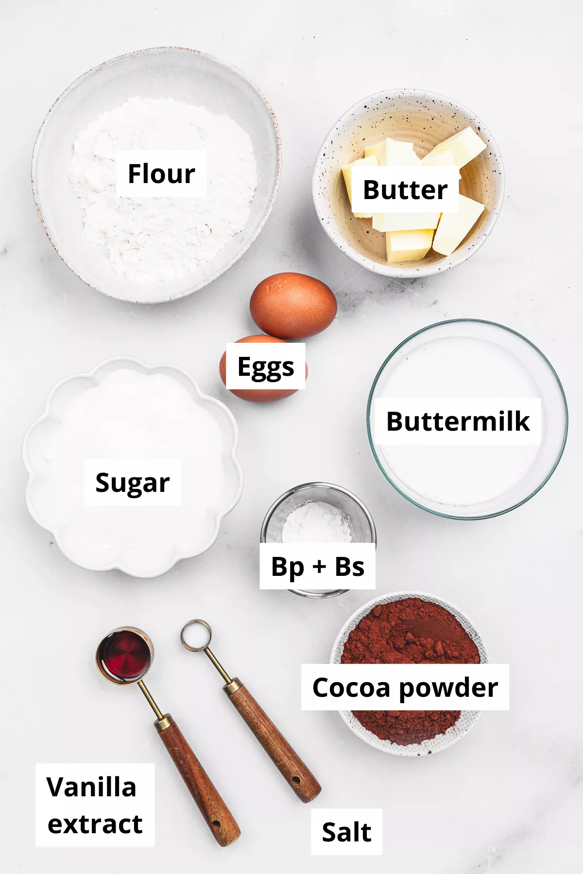 chocolate cupcake ingredients measured in bowls