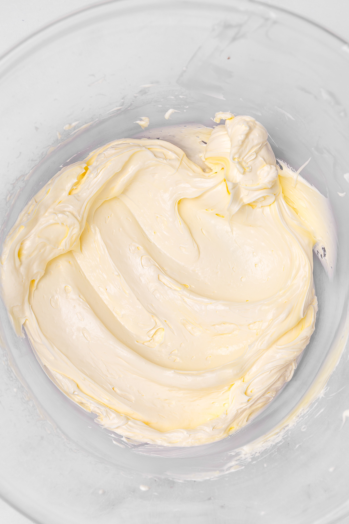 Mixing bowl with beaten butter for cinnamon buttercream
