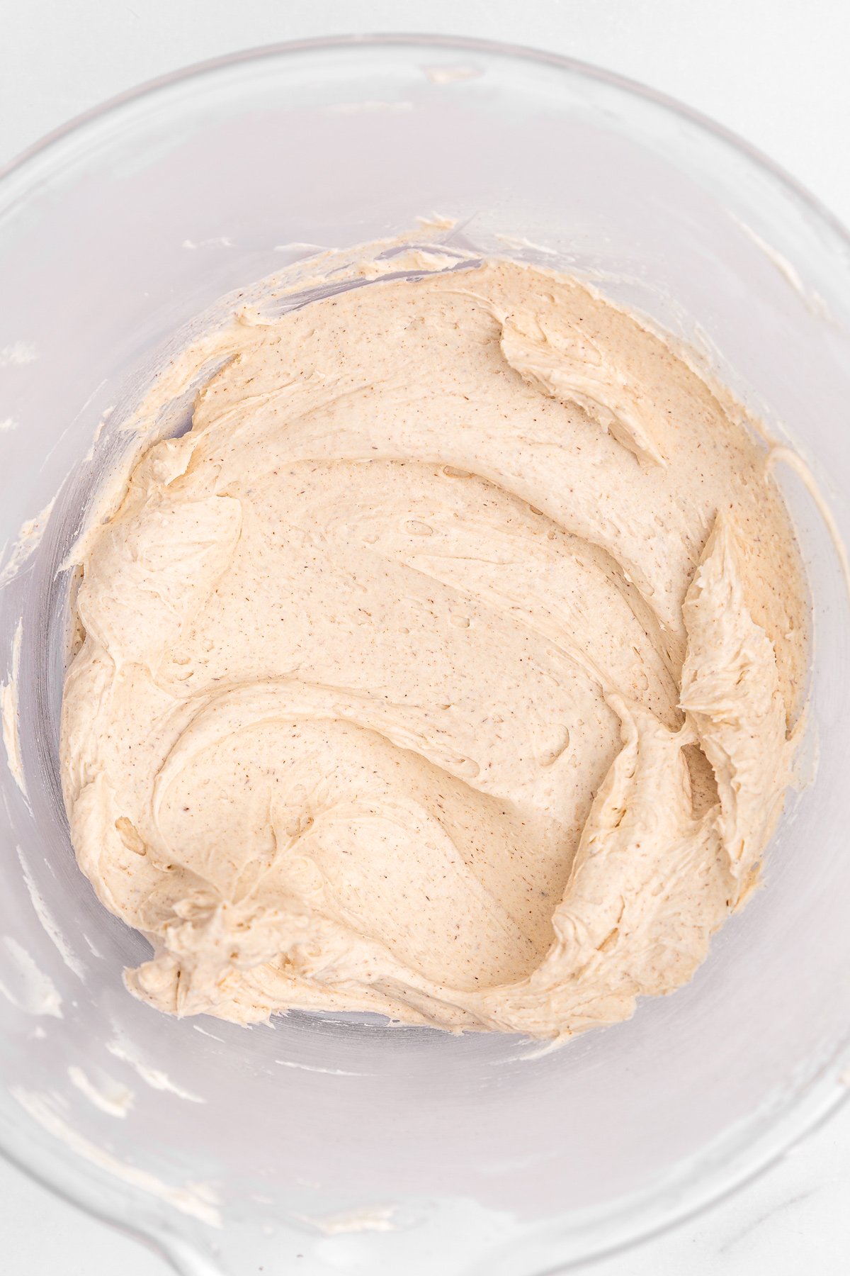 Mixing bowl with finished cinnamon buttercream frosting