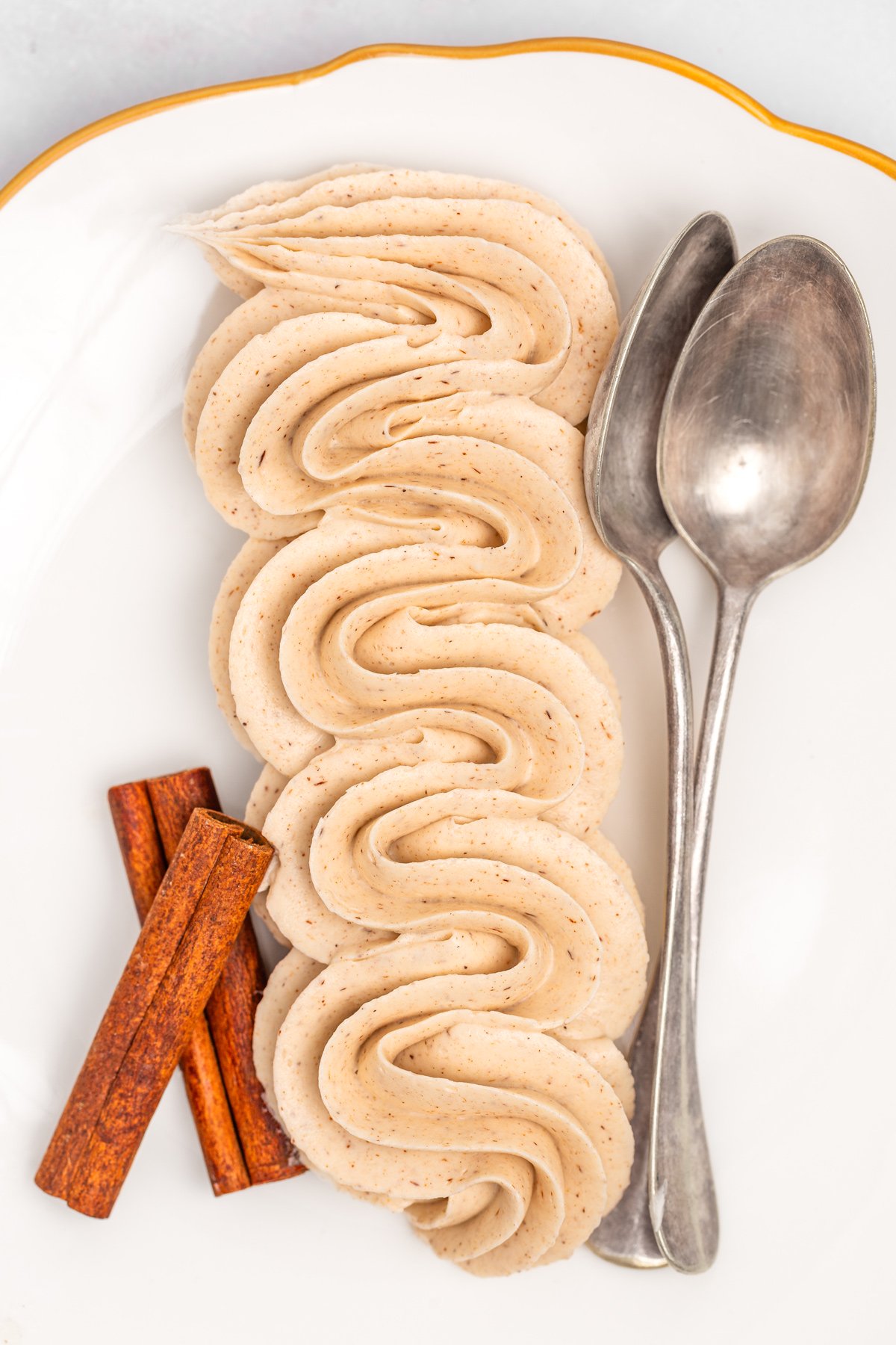 Plate with cinnamon buttercream piped using a piping bag
