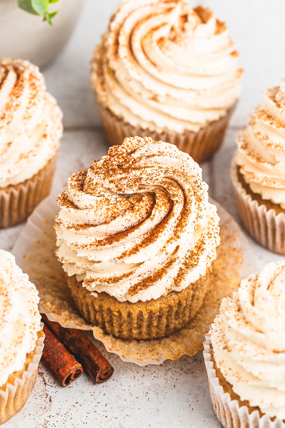 Close up of fluffy cinnamon whipped cream on a cupcakes
