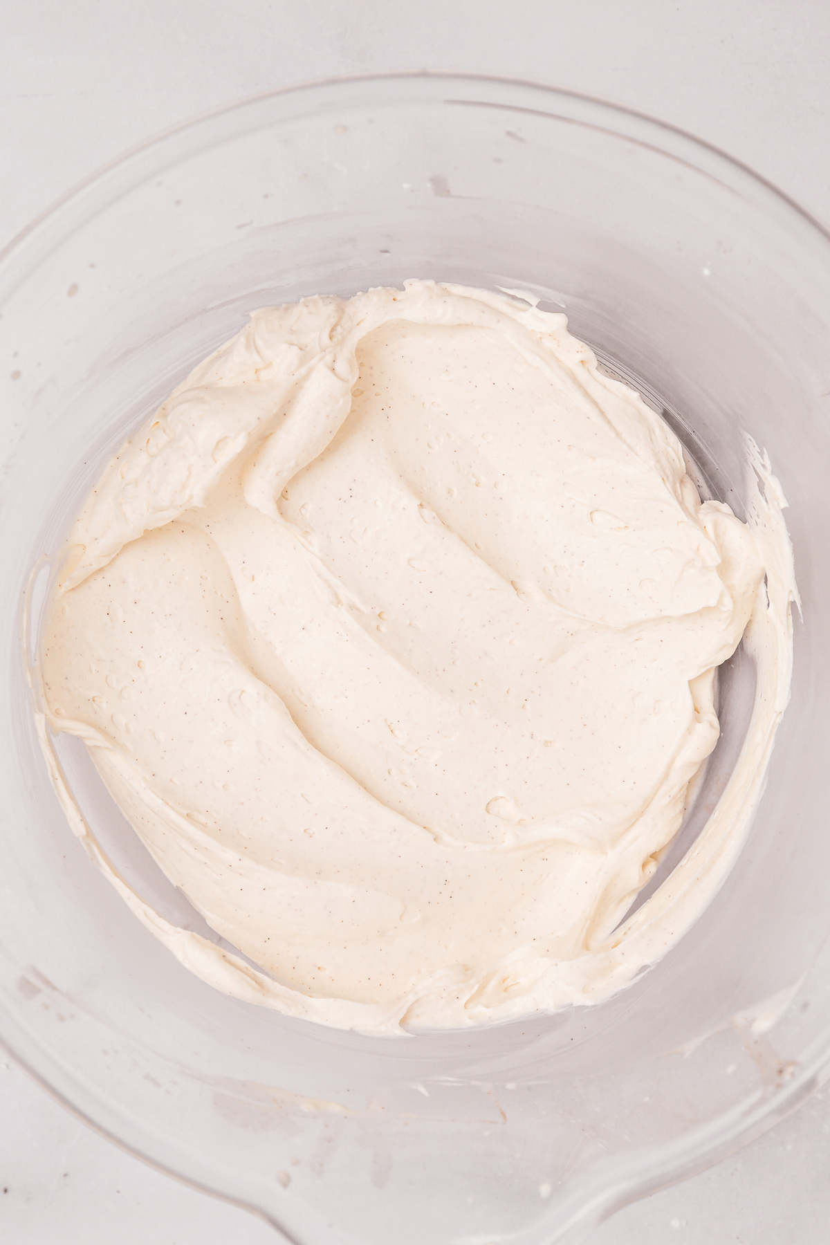 Mascarpone and cream whipped with cinnamon in a bowl