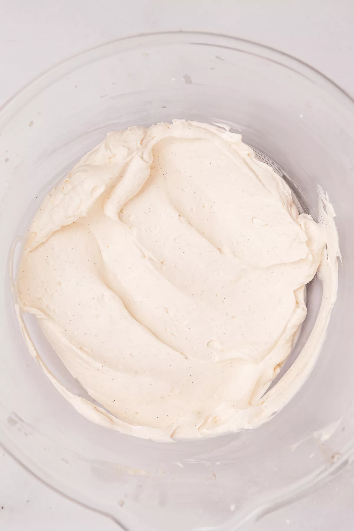 Mascarpone and cream whipped with cinnamon in a bowl