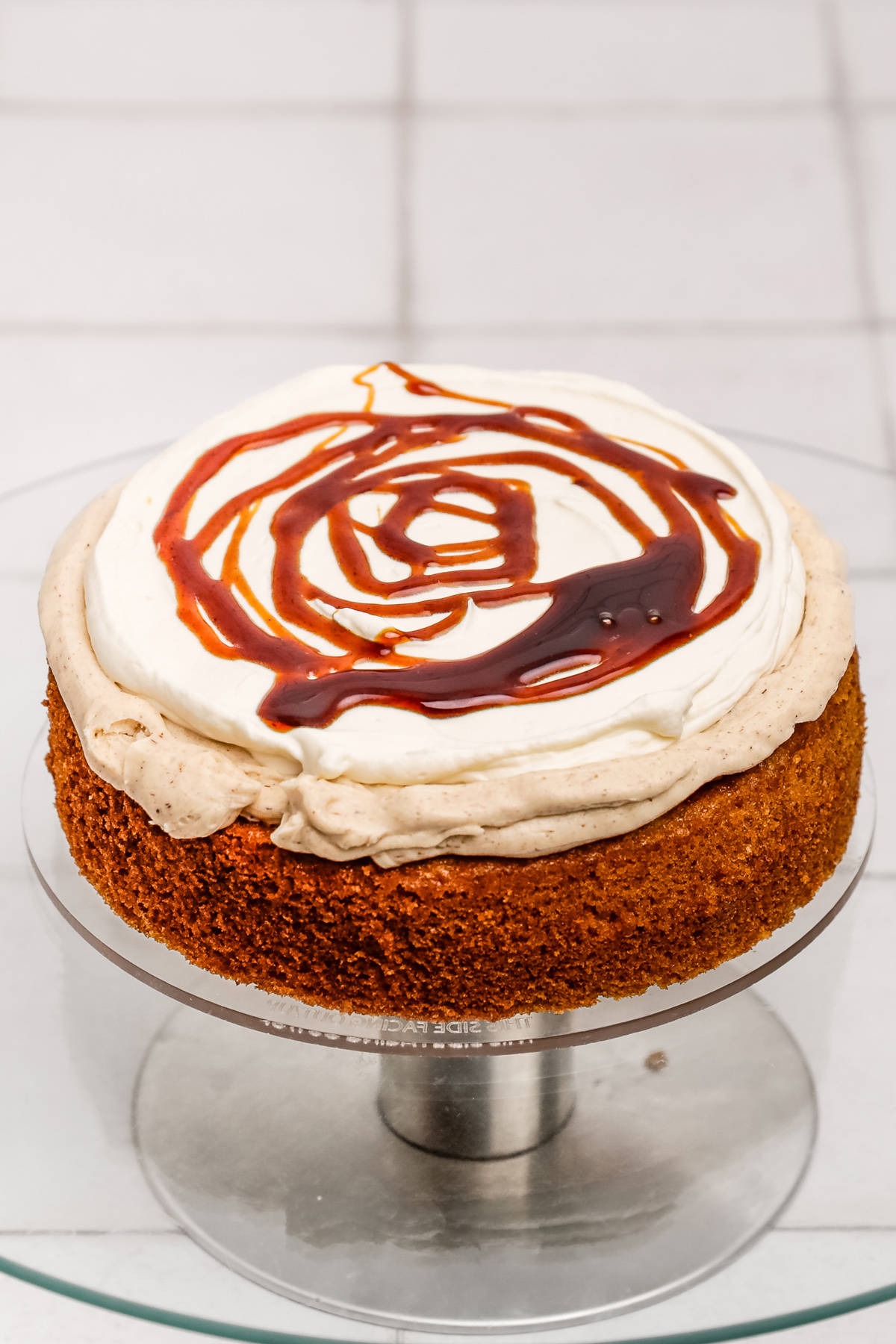 Cinnamon cake layer topped with cream cheese filling