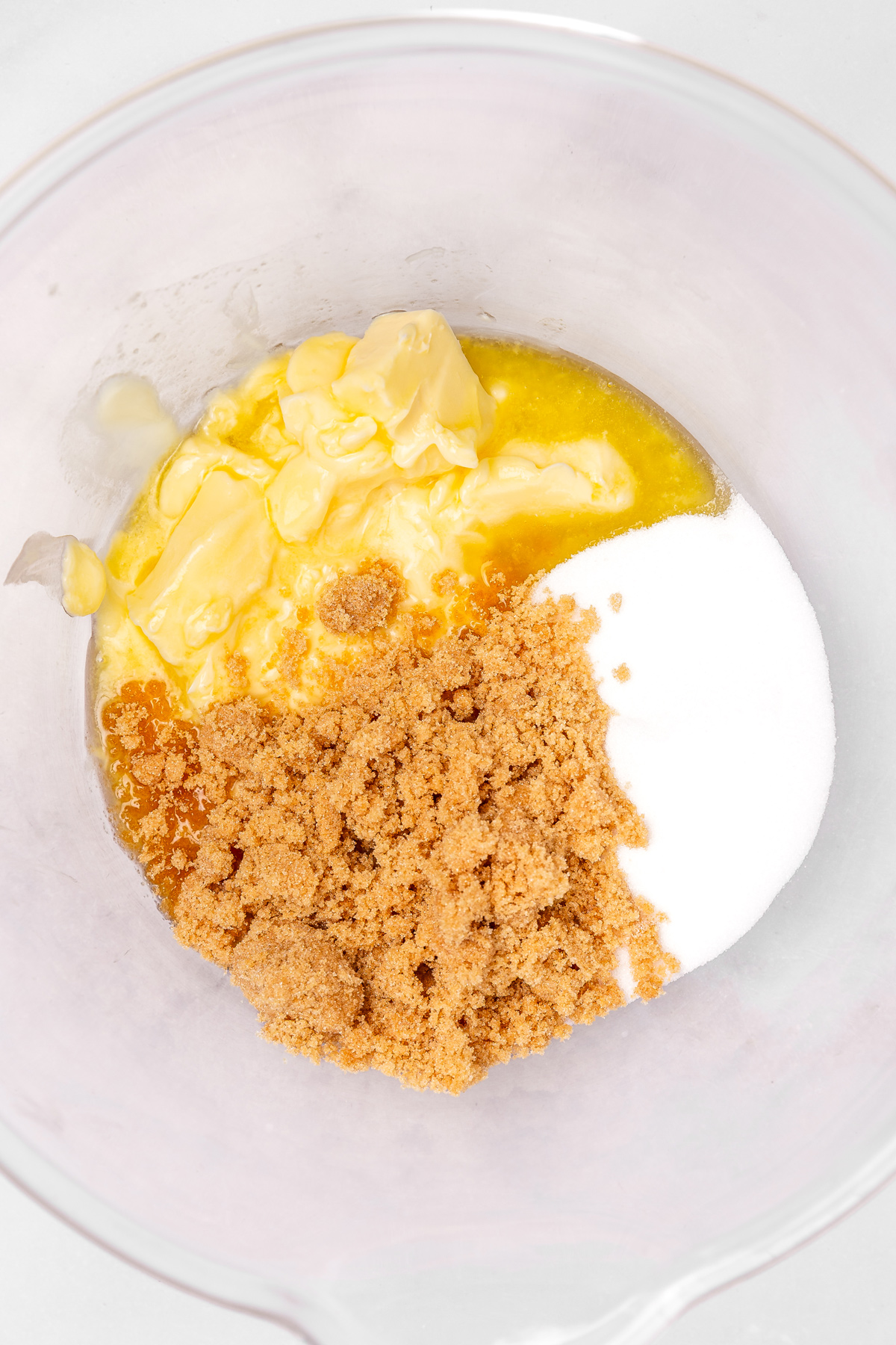 Mixing bowl with butter, granulated sugar, and brown sugar