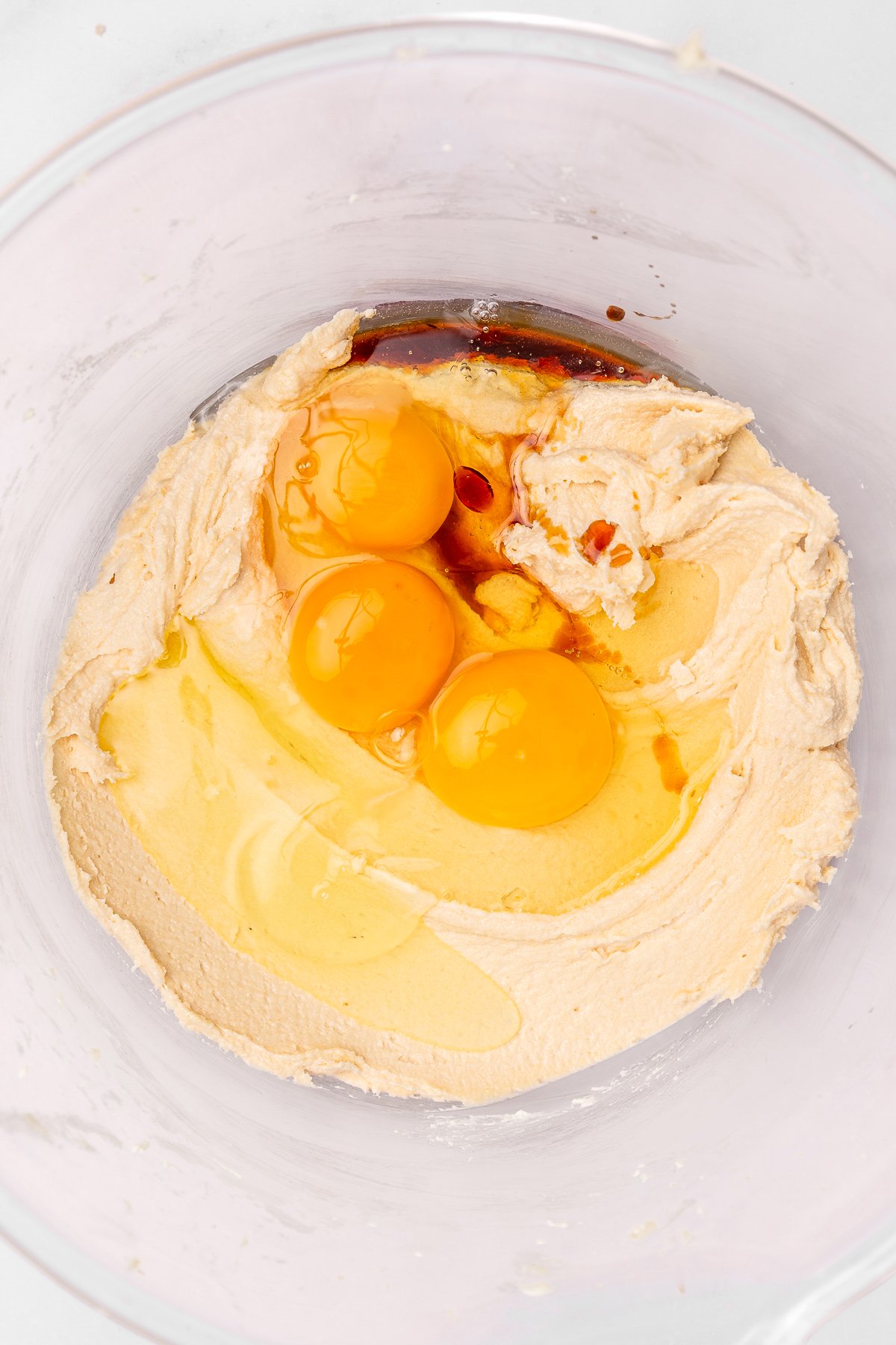 Butter and sugar beaten with eggs and vanilla in a bowl