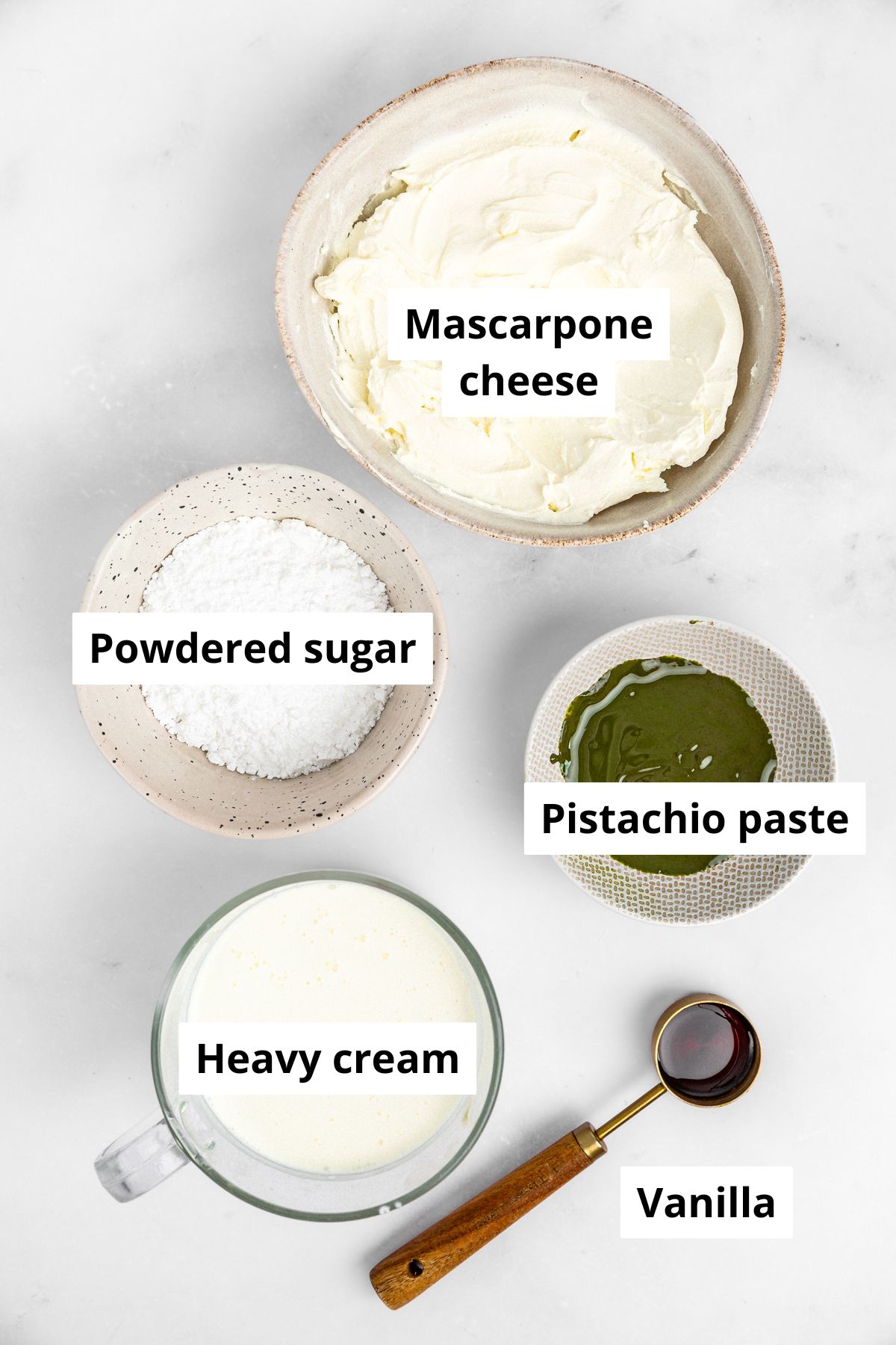 Bowls with ingredients to make pistachio frosting
