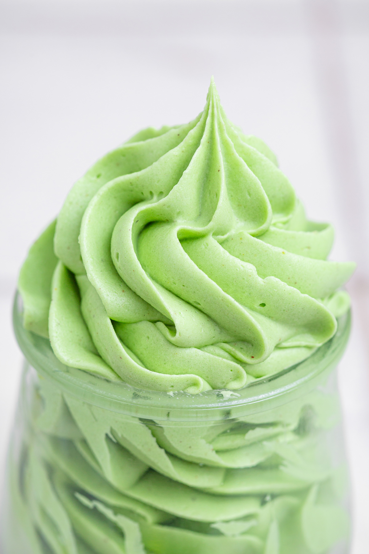 Close up of pistachio buttercream frosting with smooth consistency