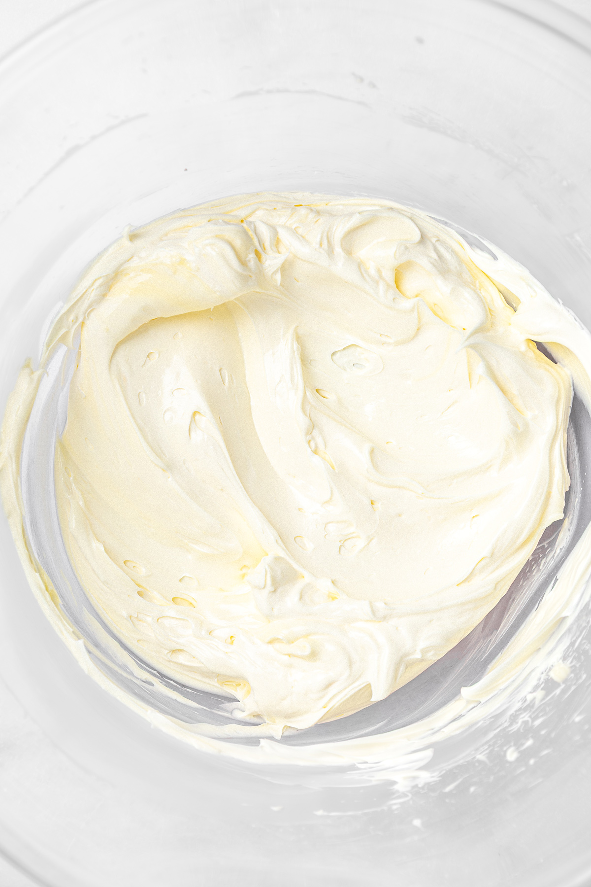Mixing bowl with whipped butter for pistachio buttercream recipe