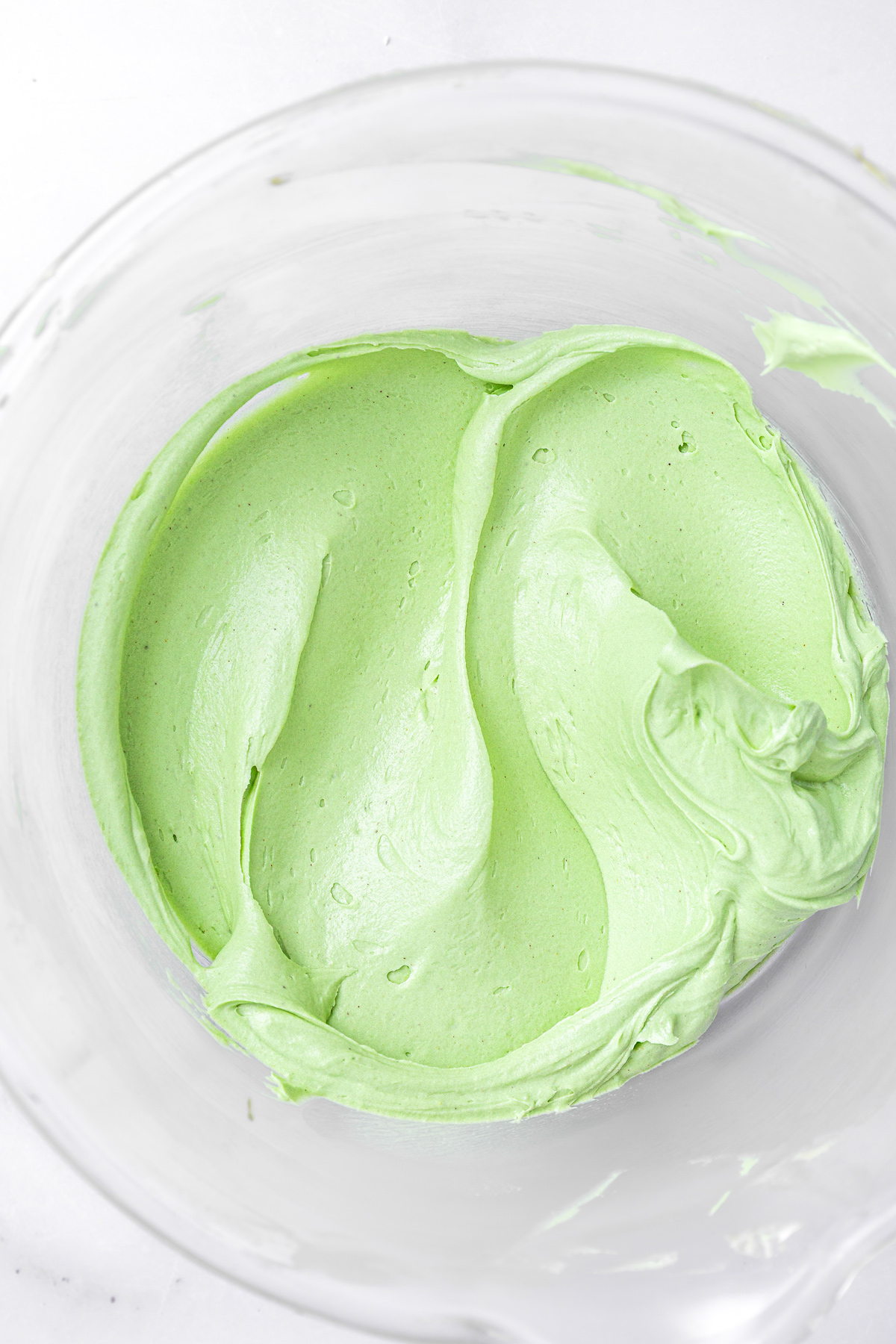 Green pistachio buttercream in a mixing bowl, ready to use