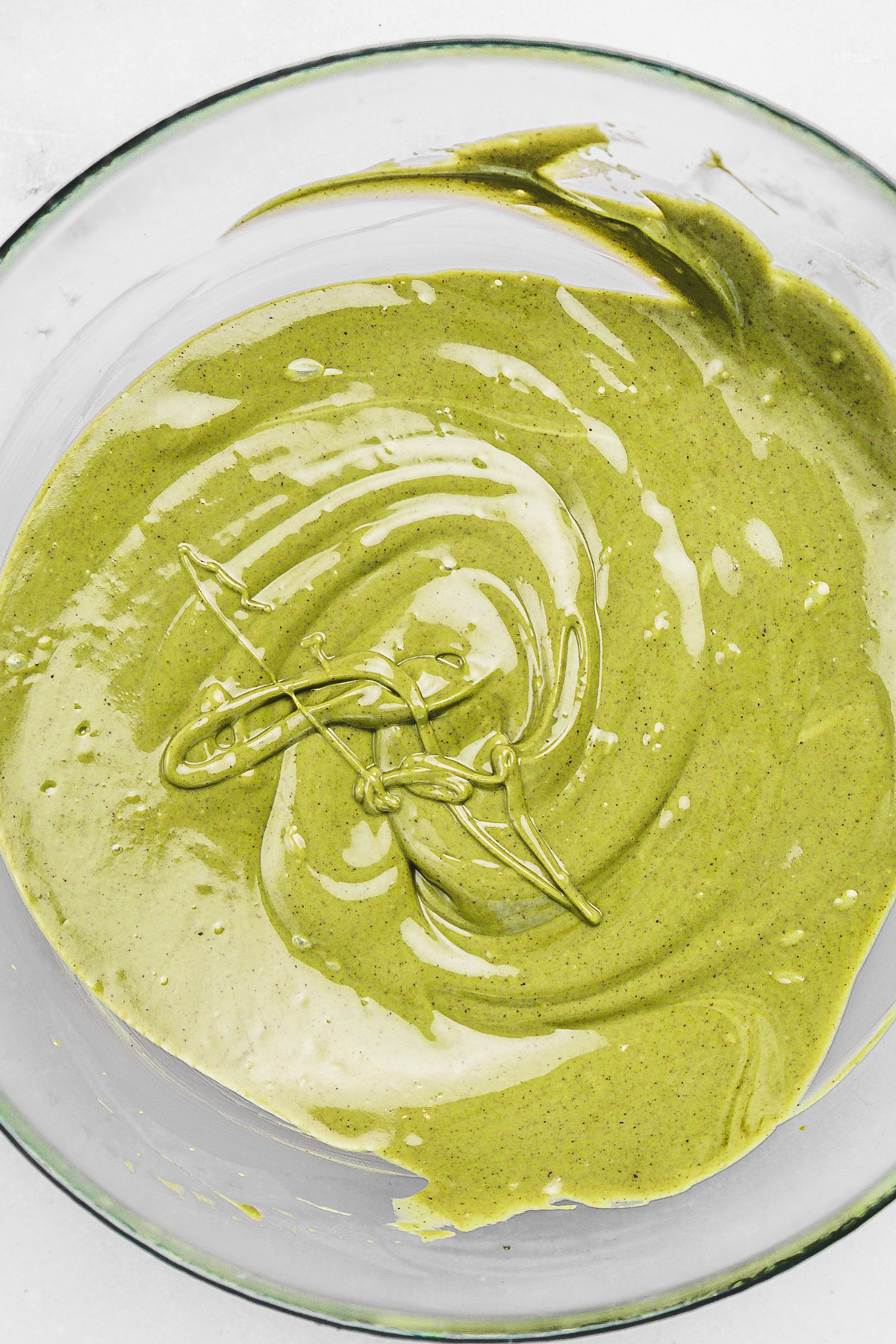 White chocolate blended with pistachio paste to make creamy pistachio ganache