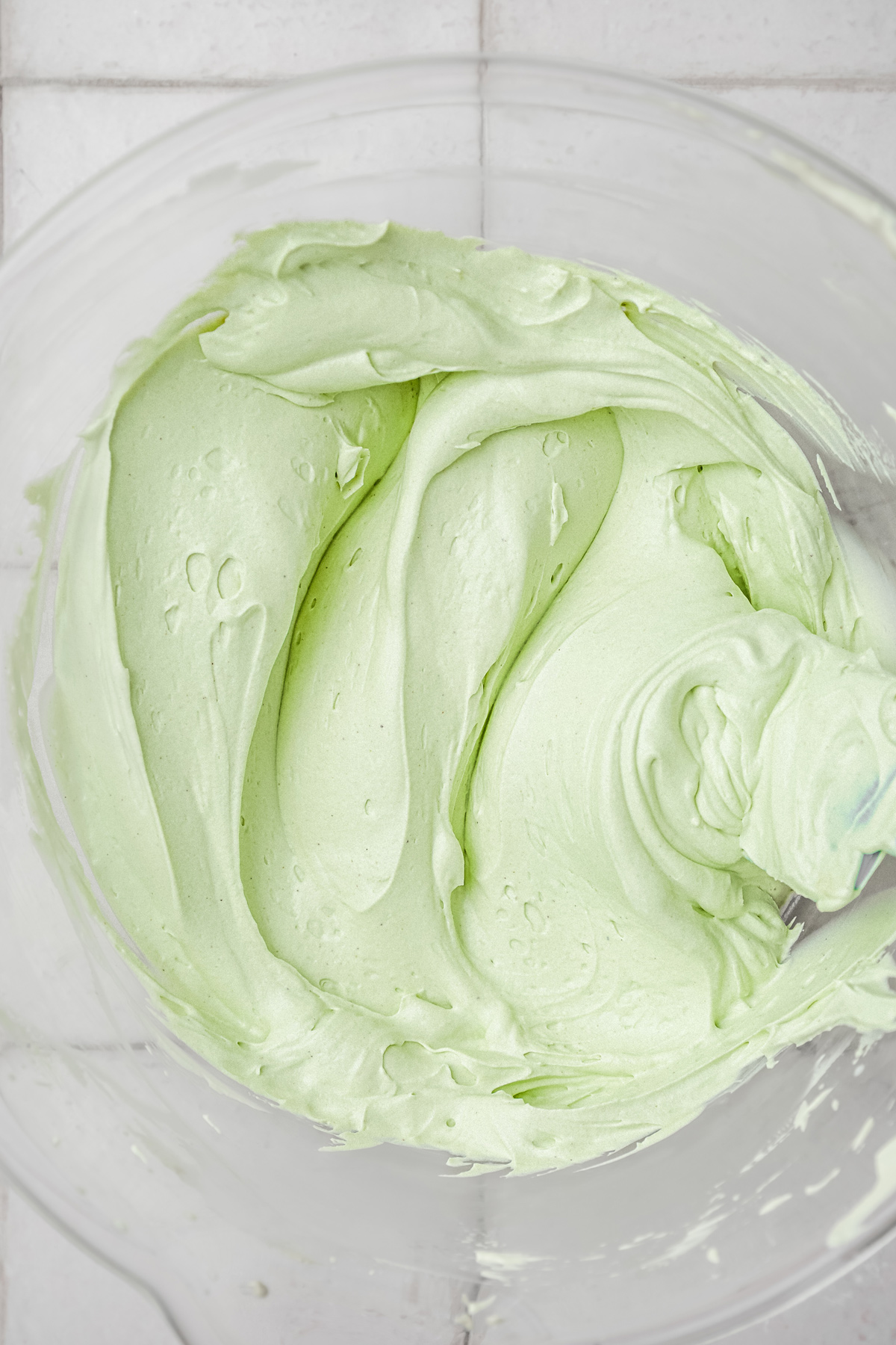 Finished pistachio frosting in a mixing bowl
