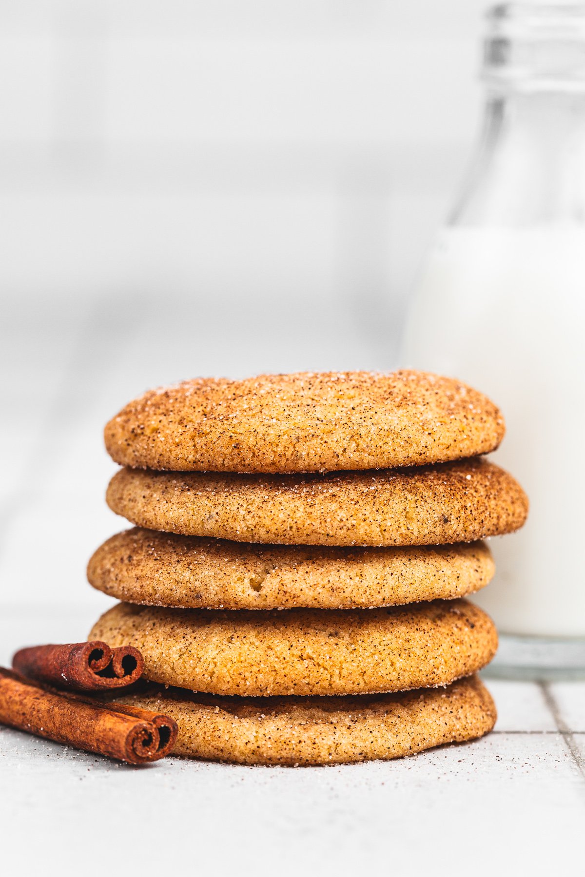 Stack of chewy brown butter snickerdoodles on a table