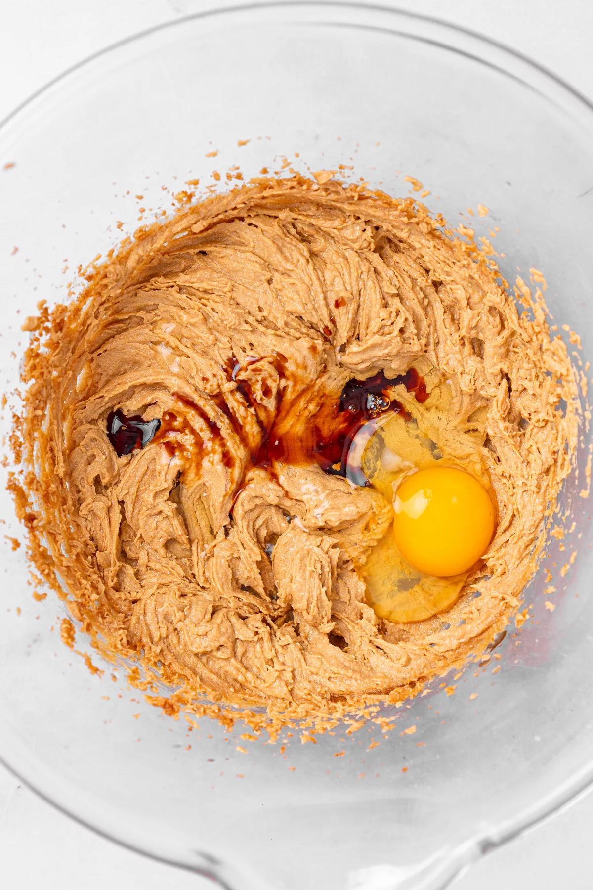 Butter, sugar, egg, and vanilla mixture for carrot cake cookies batter