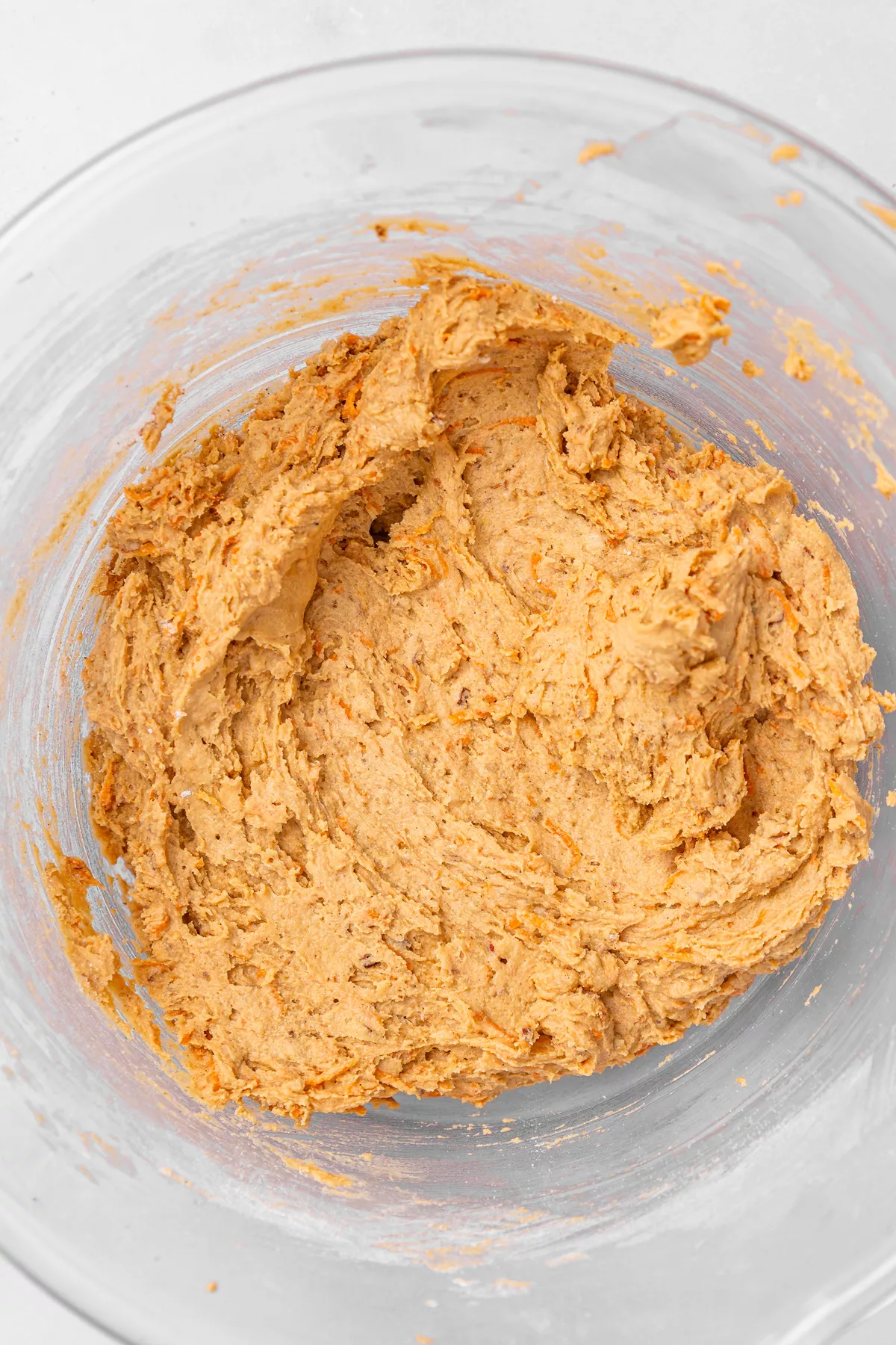 Raw carrot cake cookie dough balls on baking tray