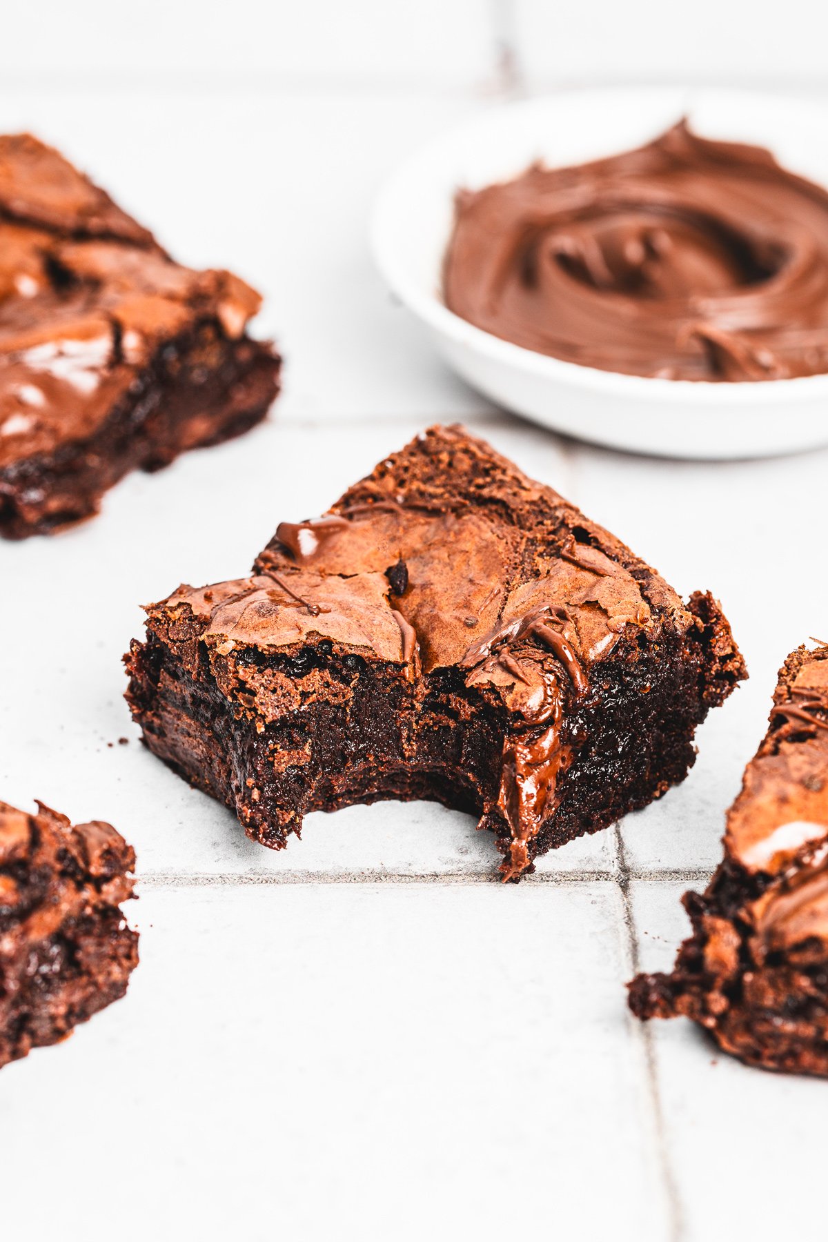 Piece of Nutella brownie with gooey chocolate center on a table