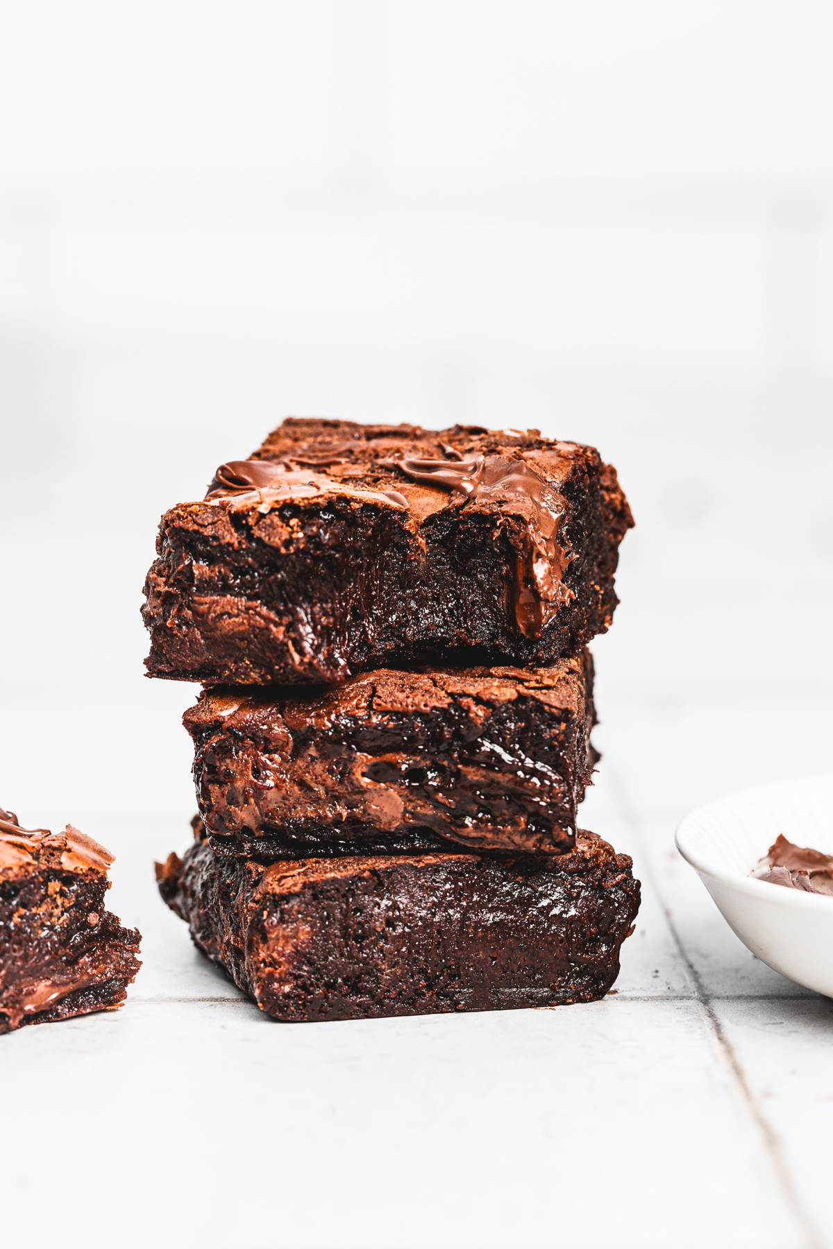 Stack of fudgy Nutella brownies on a plate