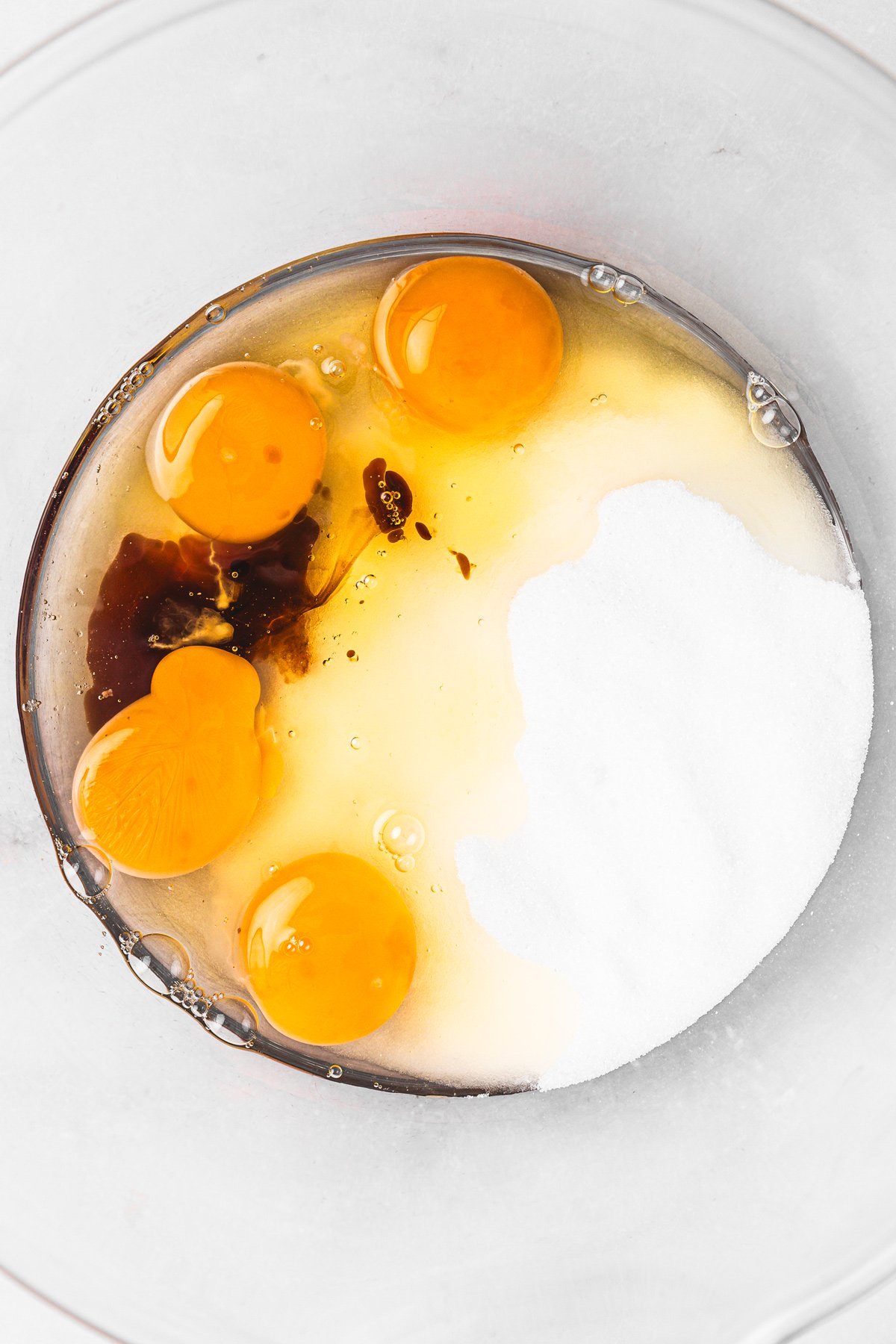 Bowl with eggs, sugar, and vanilla for brownie batter
