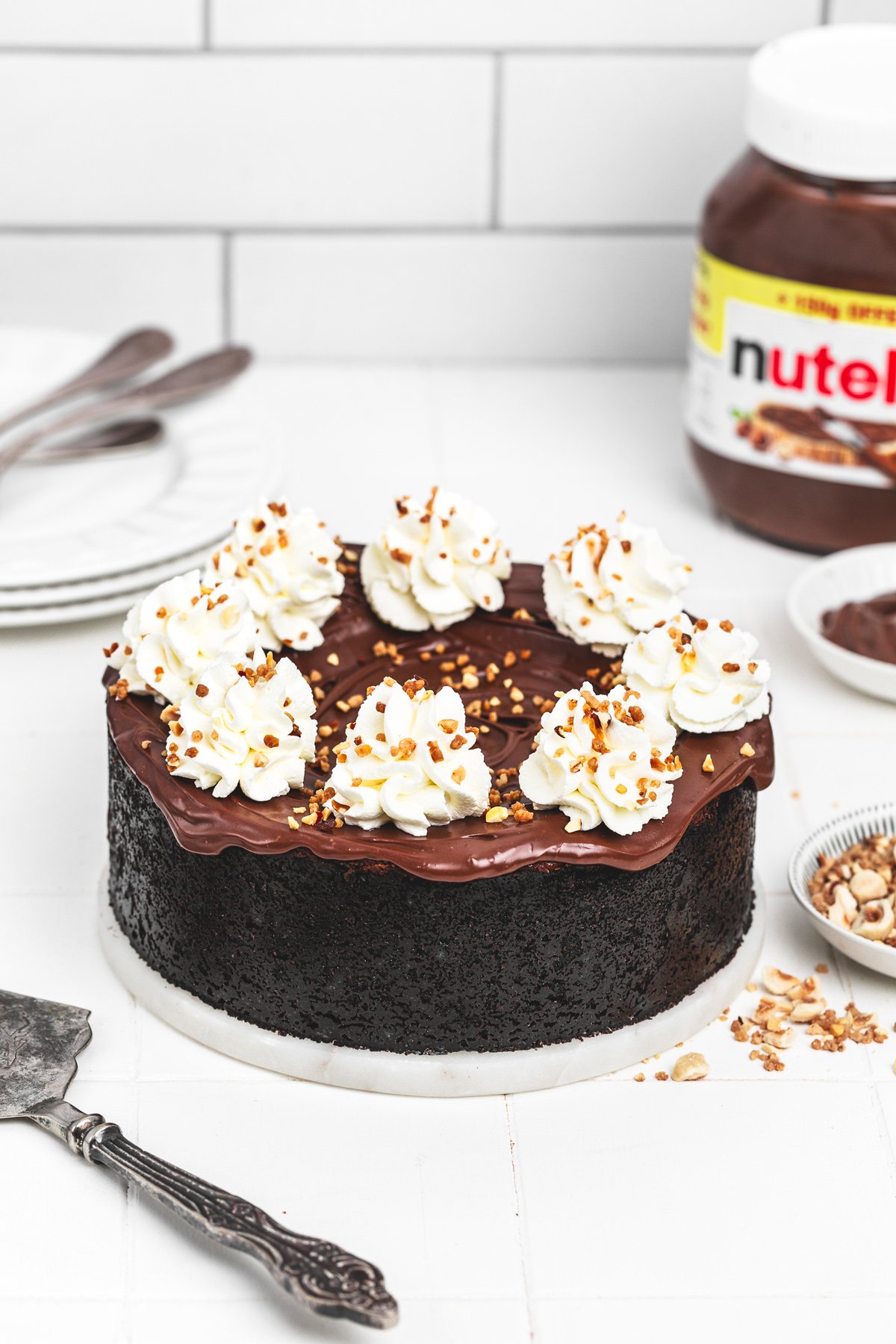 Finished Nutella cheesecake with whipped cream topping