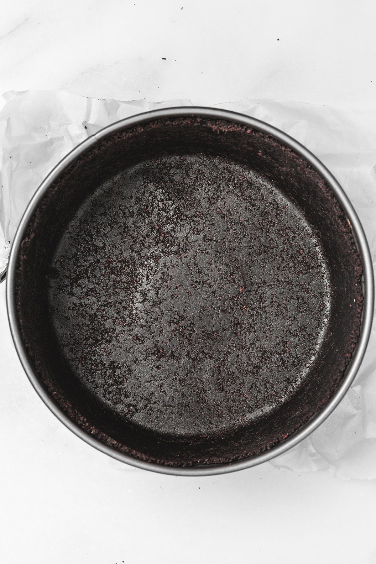 Oreo crust pressed into a springform pan