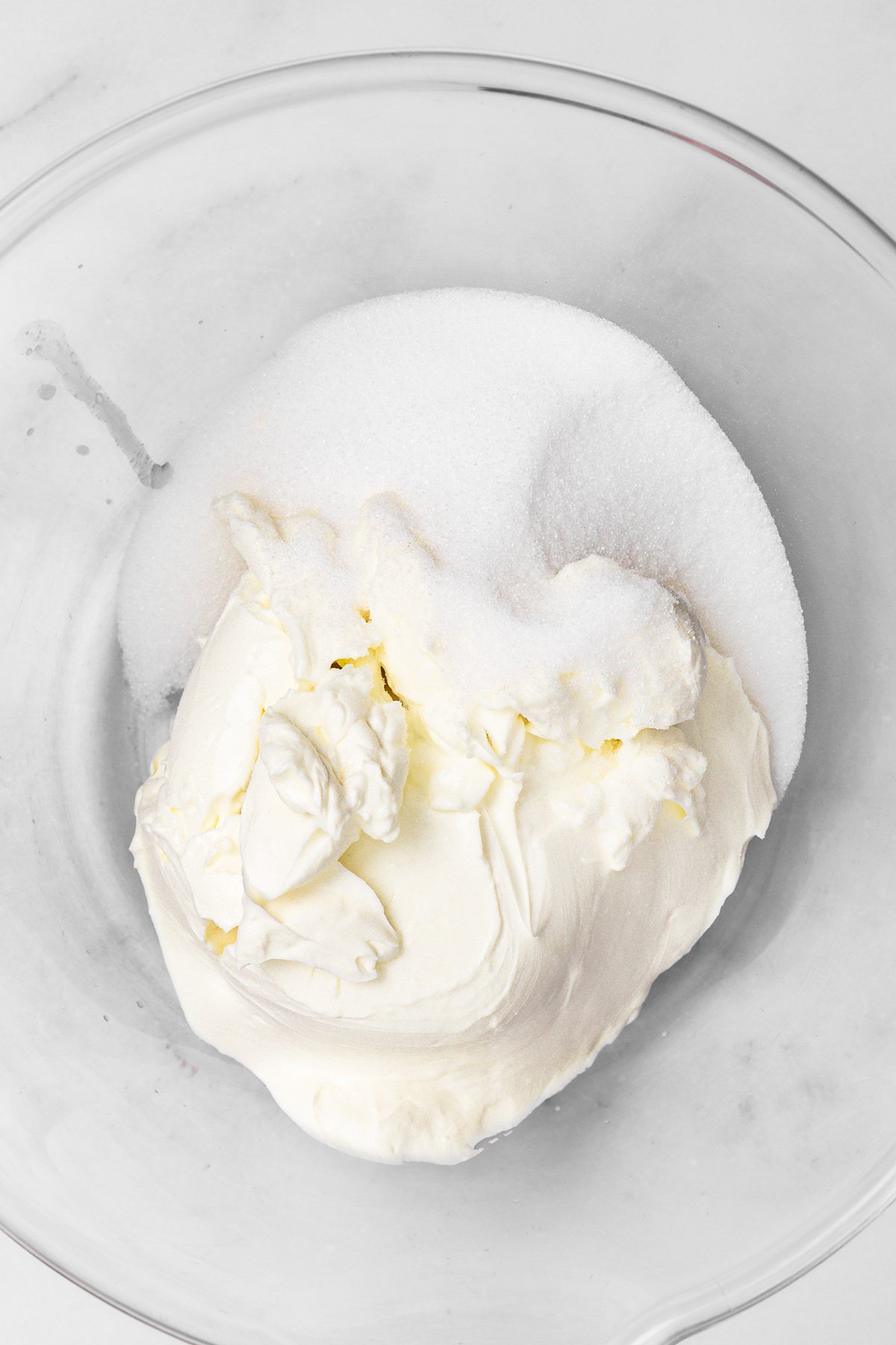 Cream cheese and sugar mixed for Nutella cheesecake filling