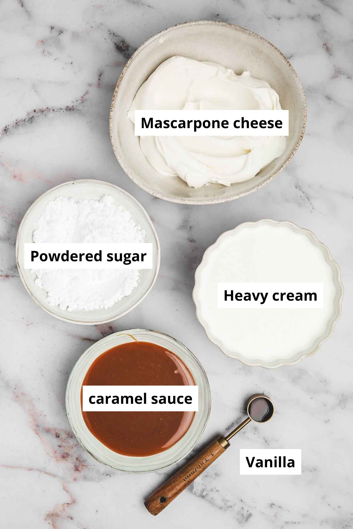 ingredients for caramel whipped cream frosting laid out on a counter