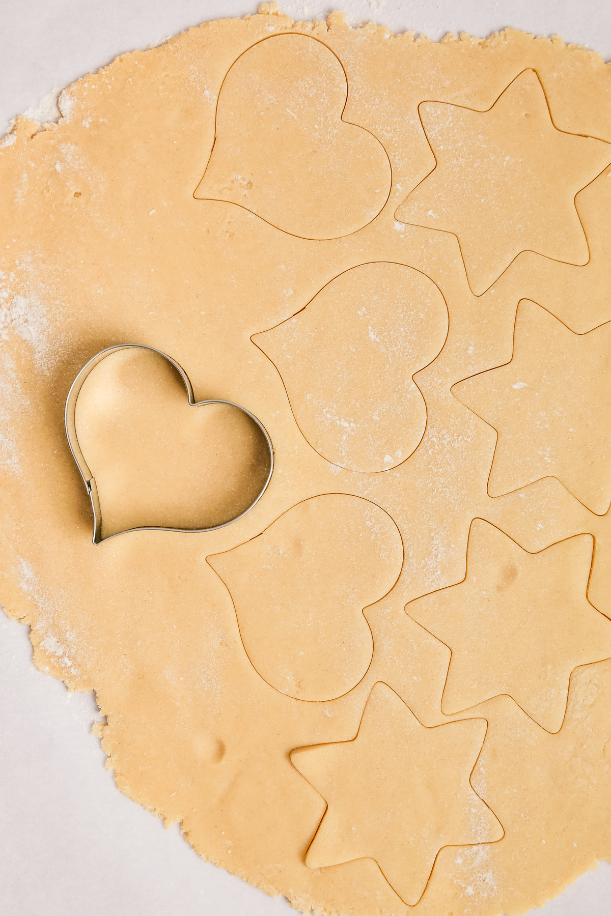 no chill sugar cookie dough rolled out and cut with cookie cutters