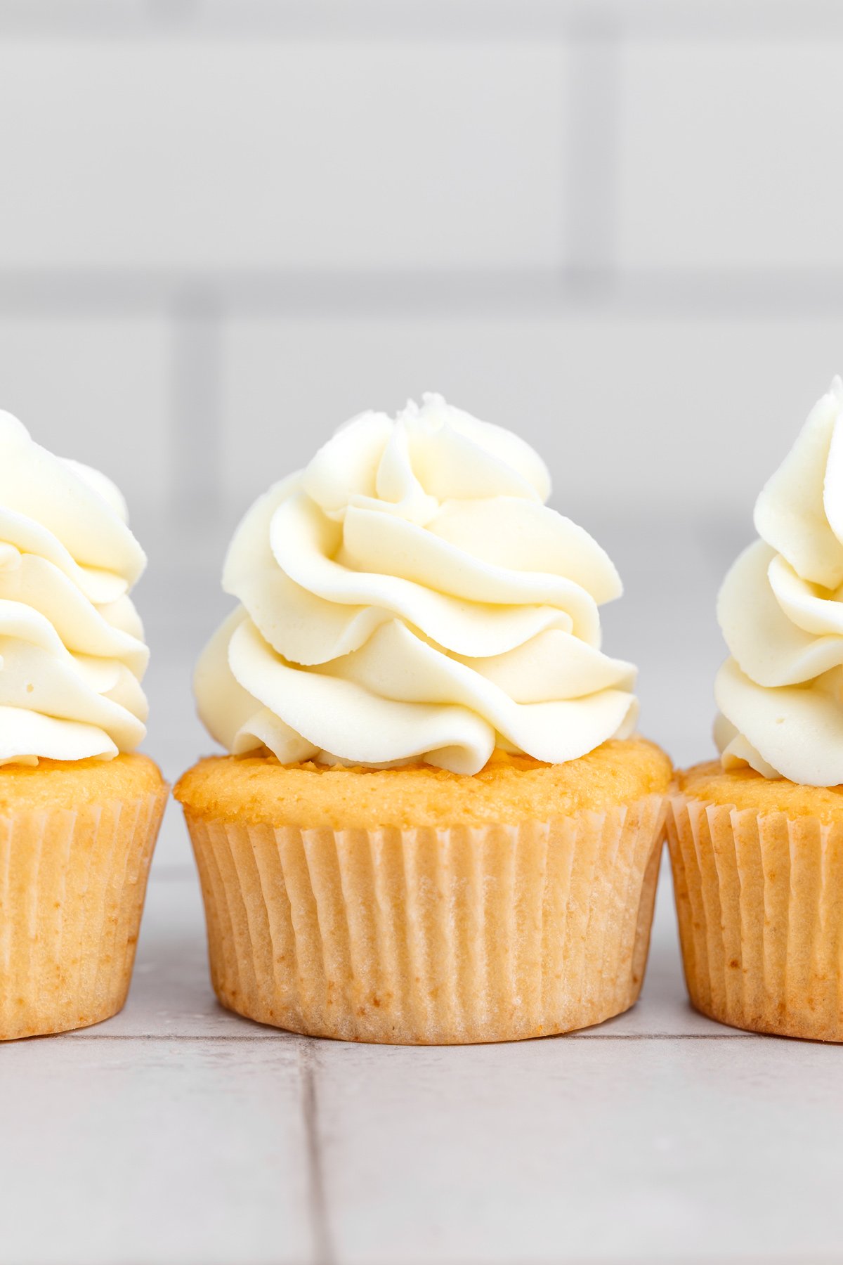 vanilla cupcakes on a table