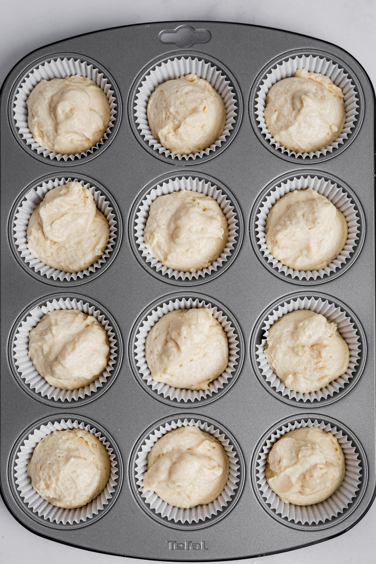 lemon cupcake batter in liners before baking