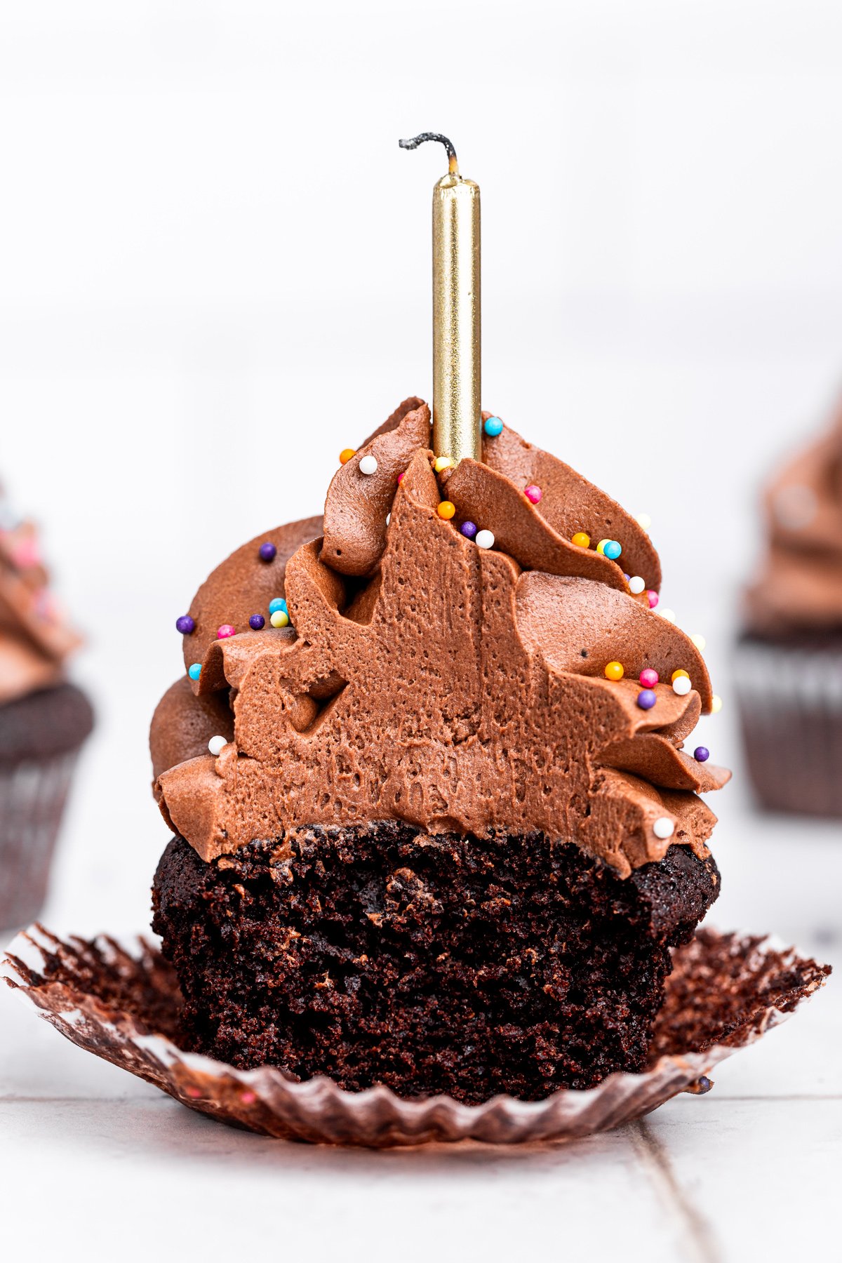 bitten birthday chocolate cupcake showing soft chocolate crumb
