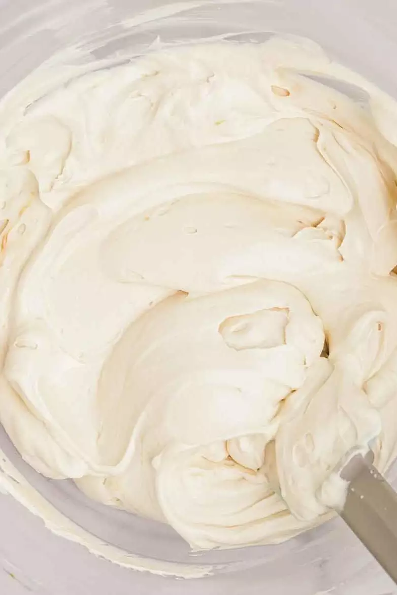 salted caramel whipped cream frosting whipped in a mixing bowl