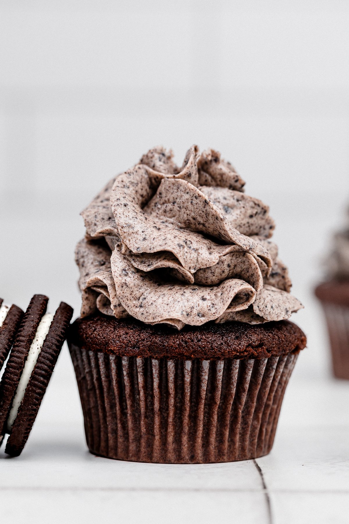 chocolate cupcakes topped with oreo buttercream frosting