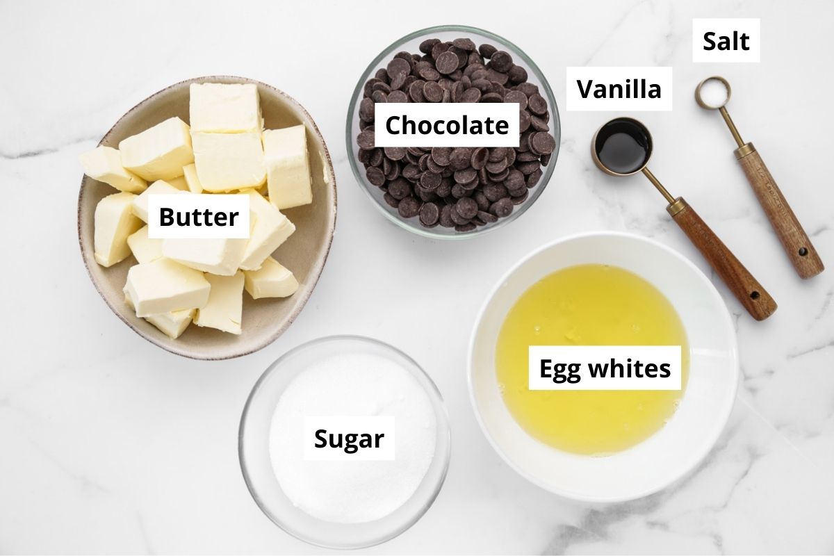 ingredients for chocolate Swiss meringue buttercream in bowls