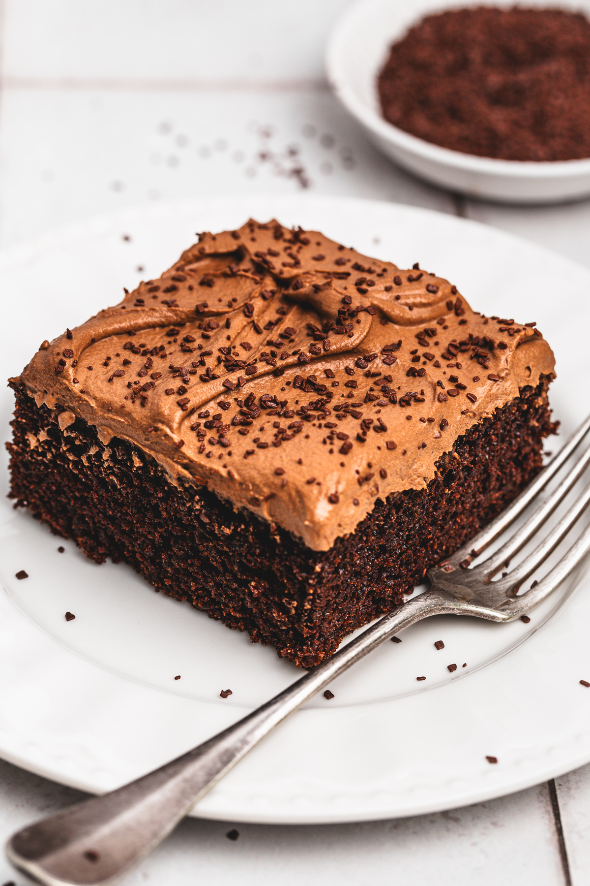 slice of chocolate sheet cake on plate with fork