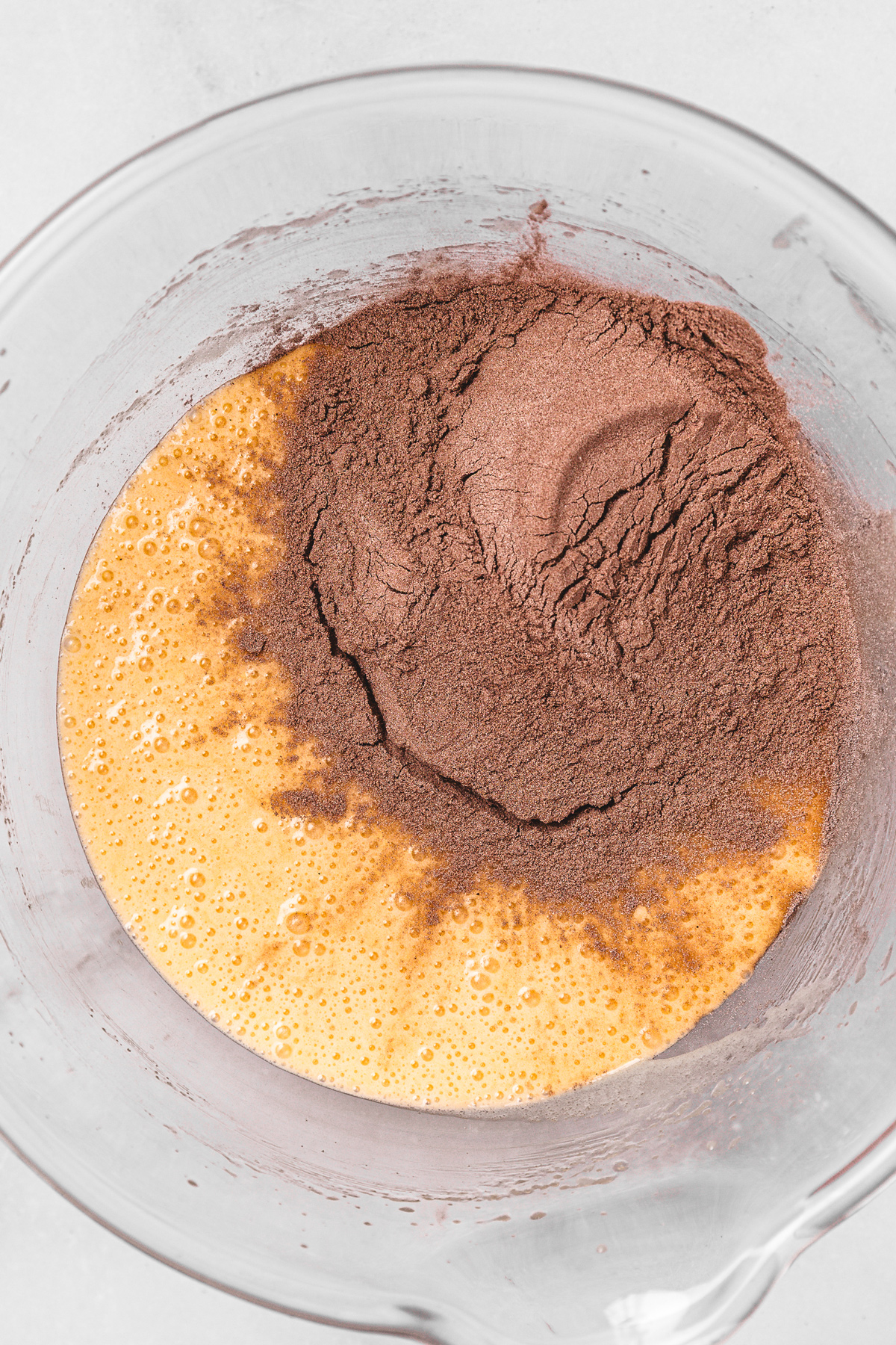 combining wet and dry ingredients for chocolate sheet cake batter