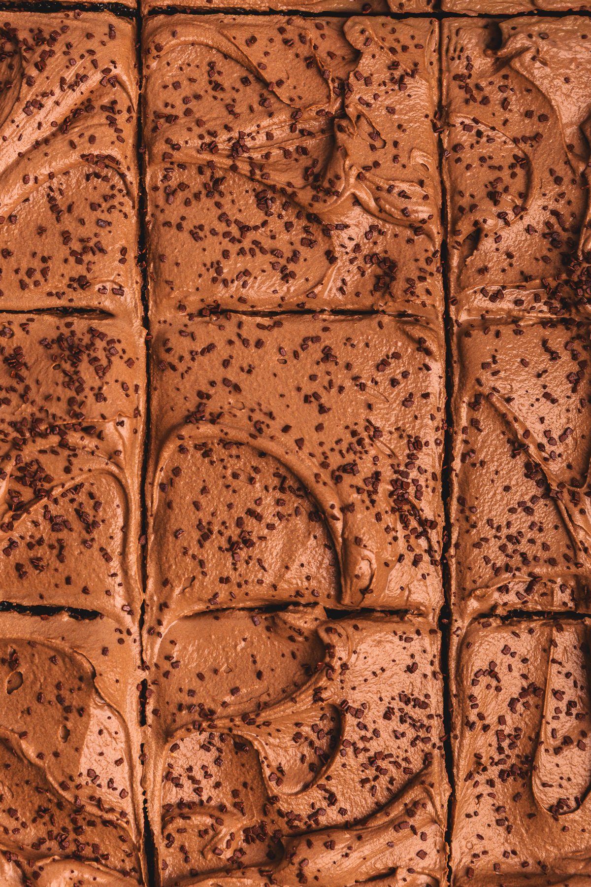 chocolate sheet cake sliced into squares