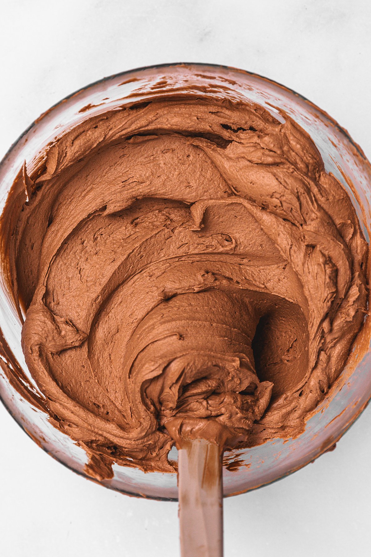 chocolate ganache frosting in mixing bowl