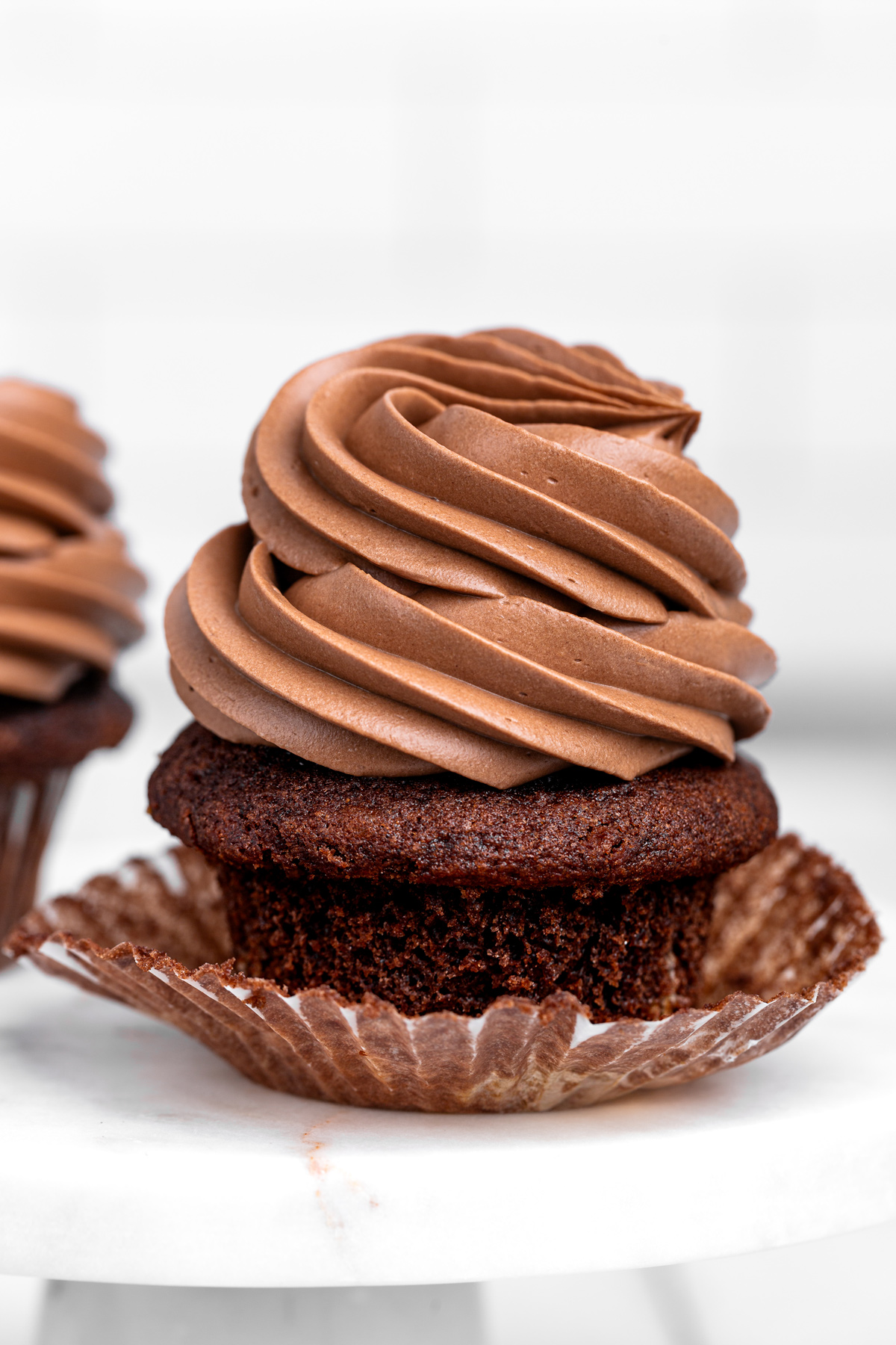 chocolate Swiss meringue buttercream piped on cupcakes