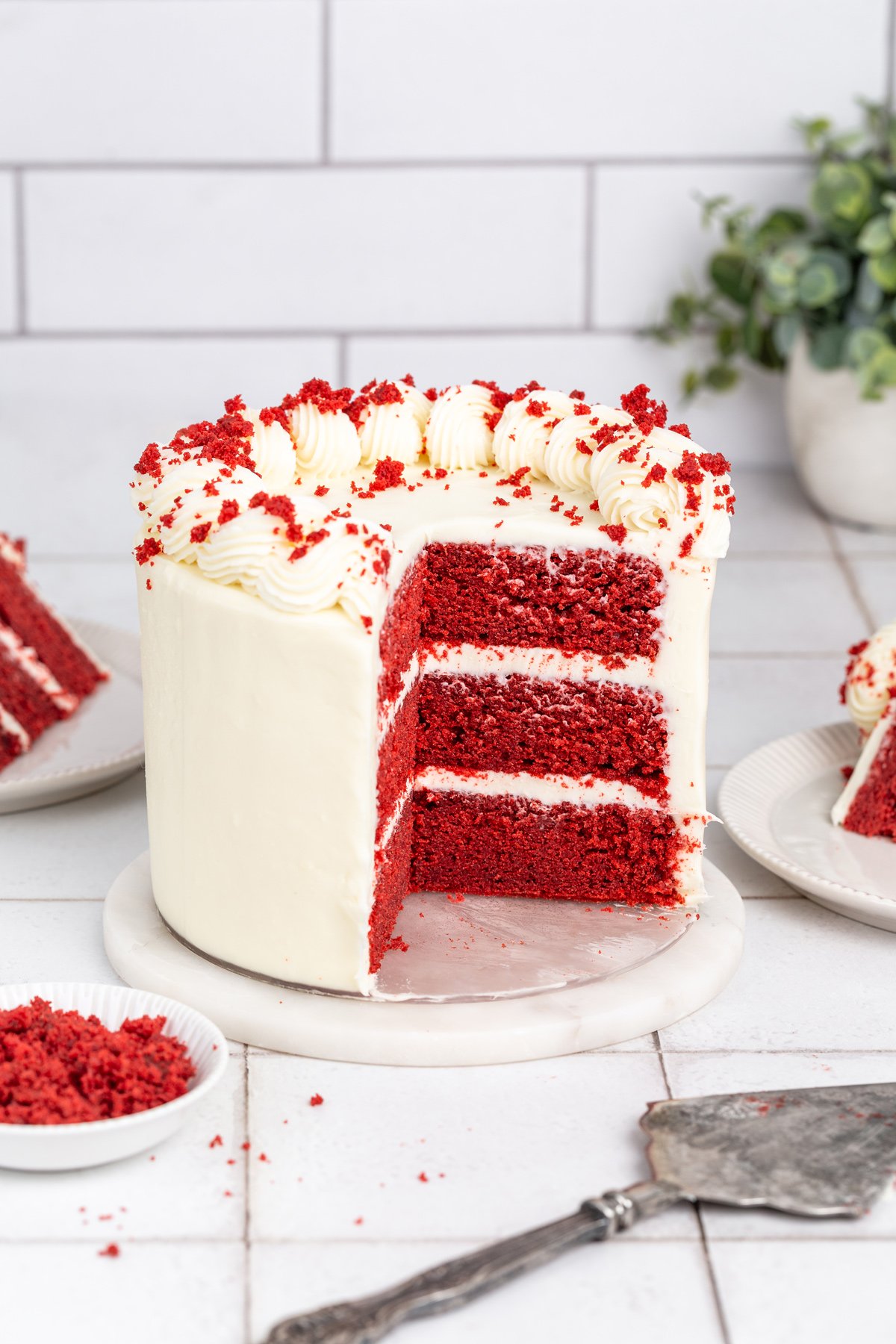 red velvet cake sliced on a table