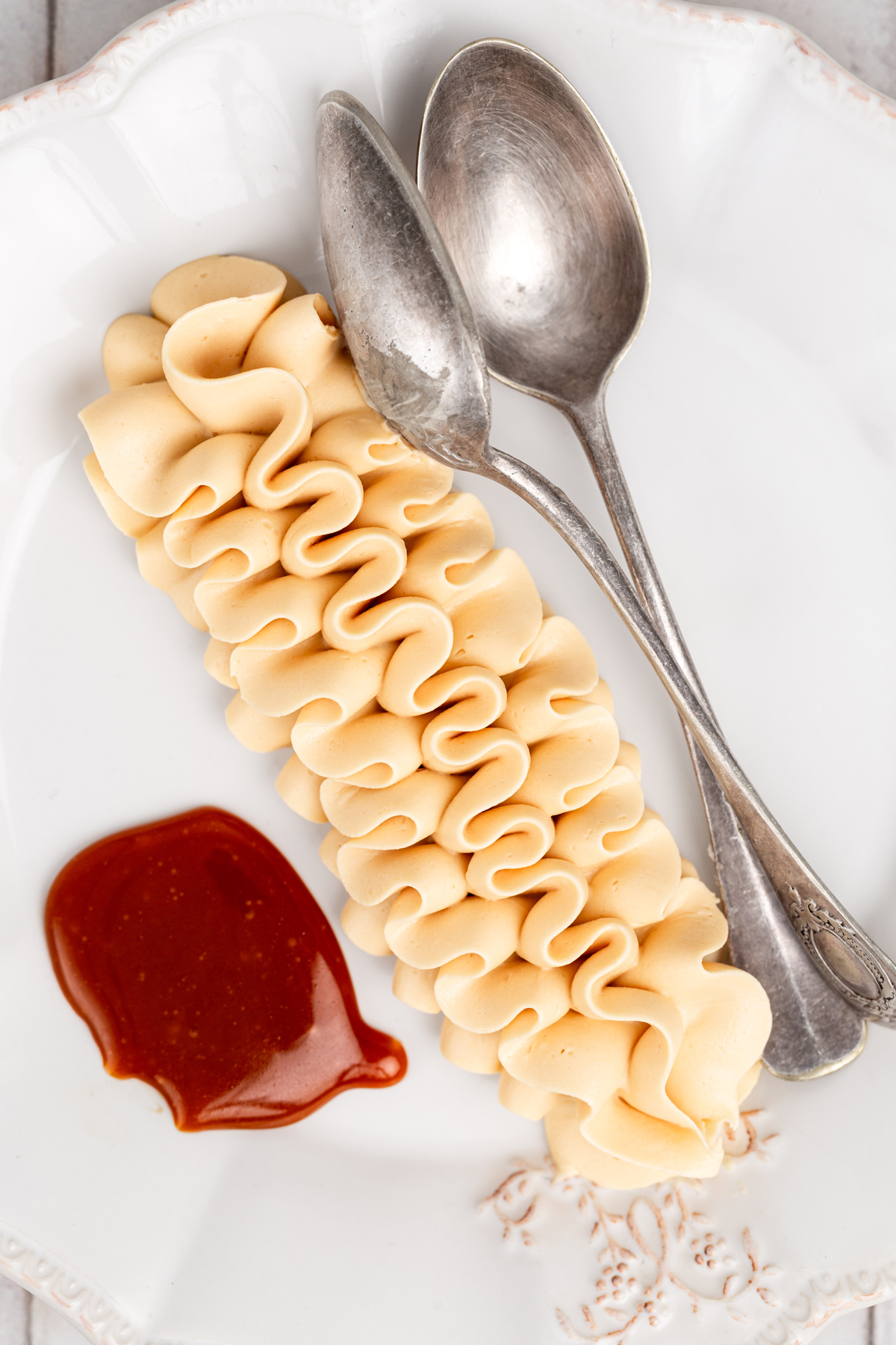 caramel buttercream frosting piped swirl on plate