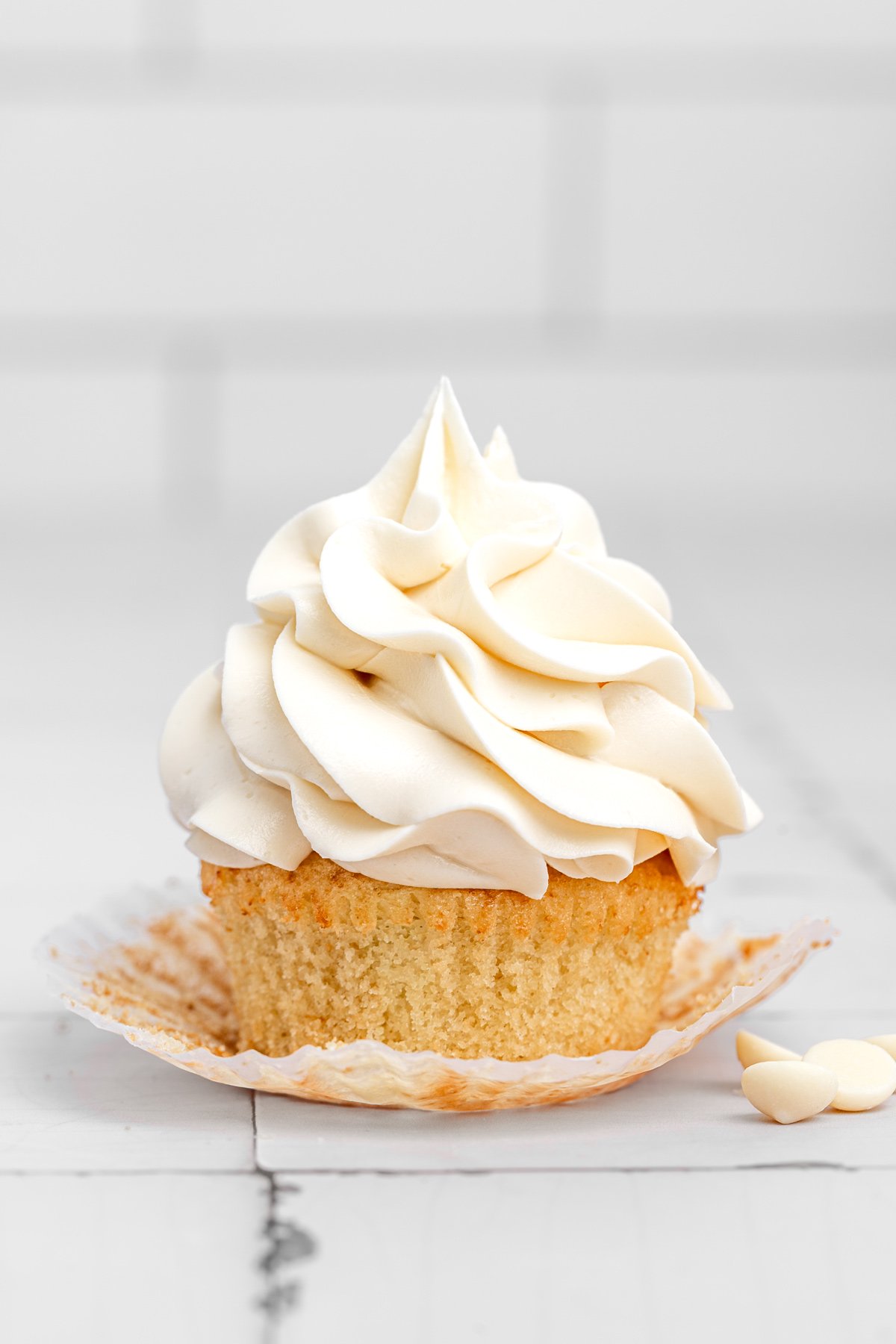 cupcake topped with white chocolate buttercream frosting