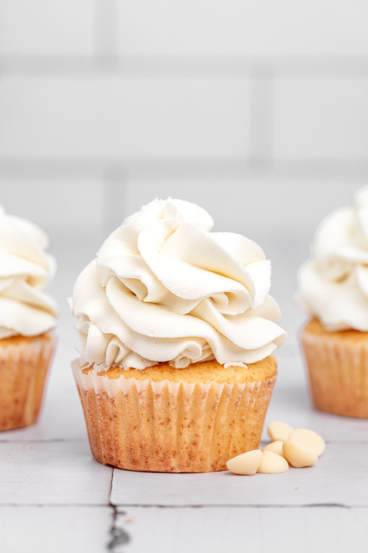 white chocolate ganache frosting on cupcakes close up