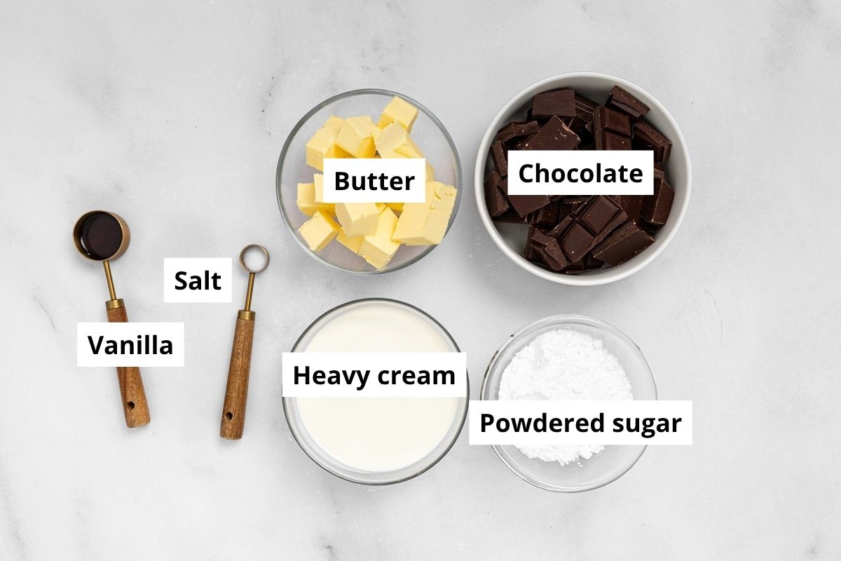 ingredients for chocolate fudge frosting in bowls